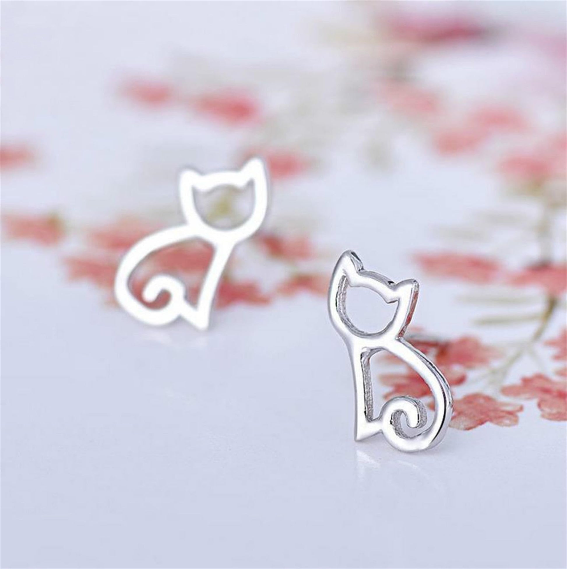 Cat outline stud earrings with butterfly-style backing, polished silver