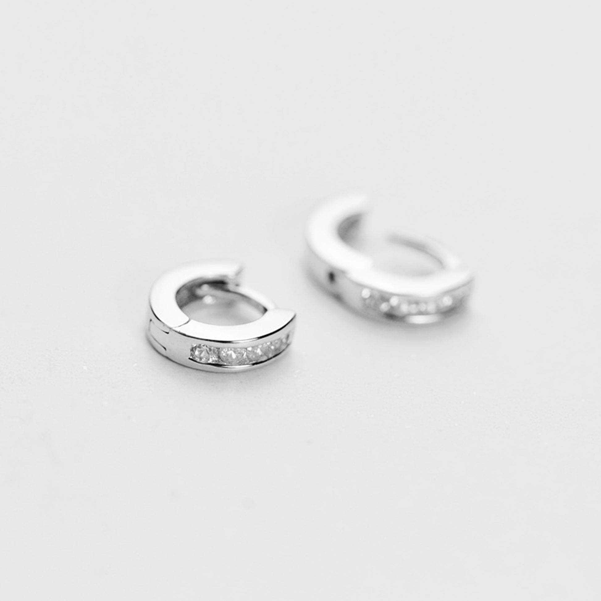 Sterling Silver Channel-Set CZ Huggie Hoop Earrings 5mm - sugarkittenlondon