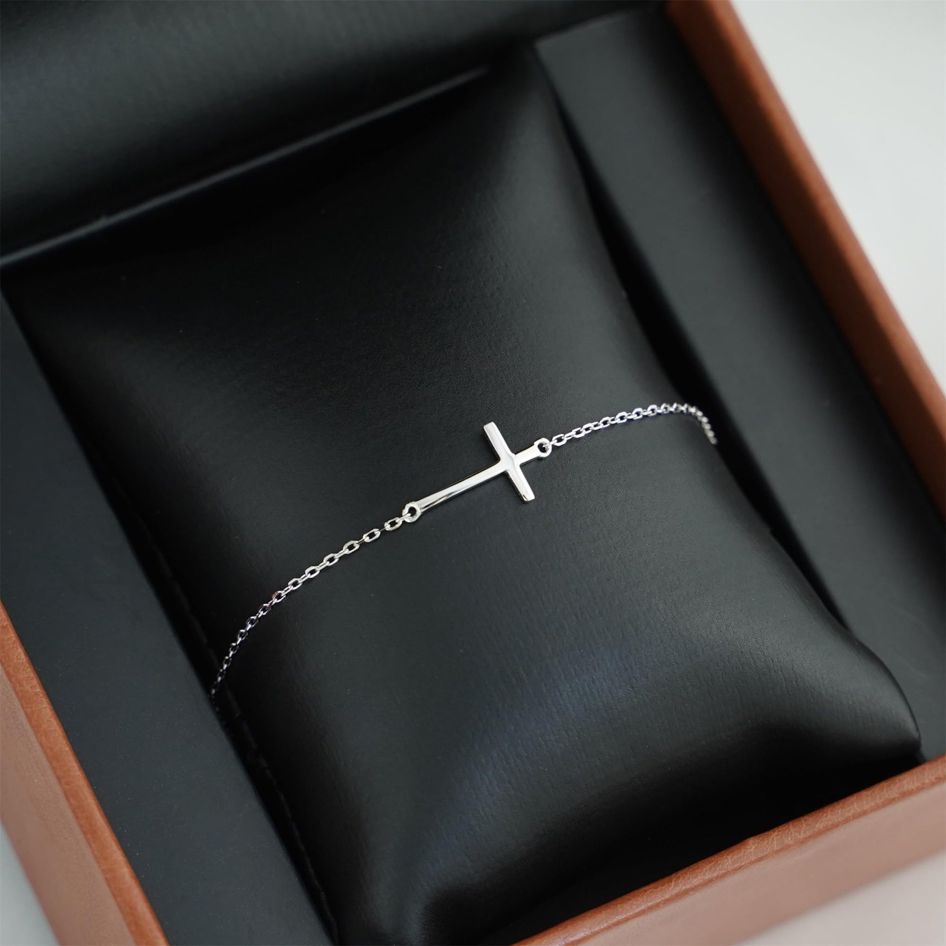 Sideways Cross anklet bracelet with small cross charm on silver-toned link chain