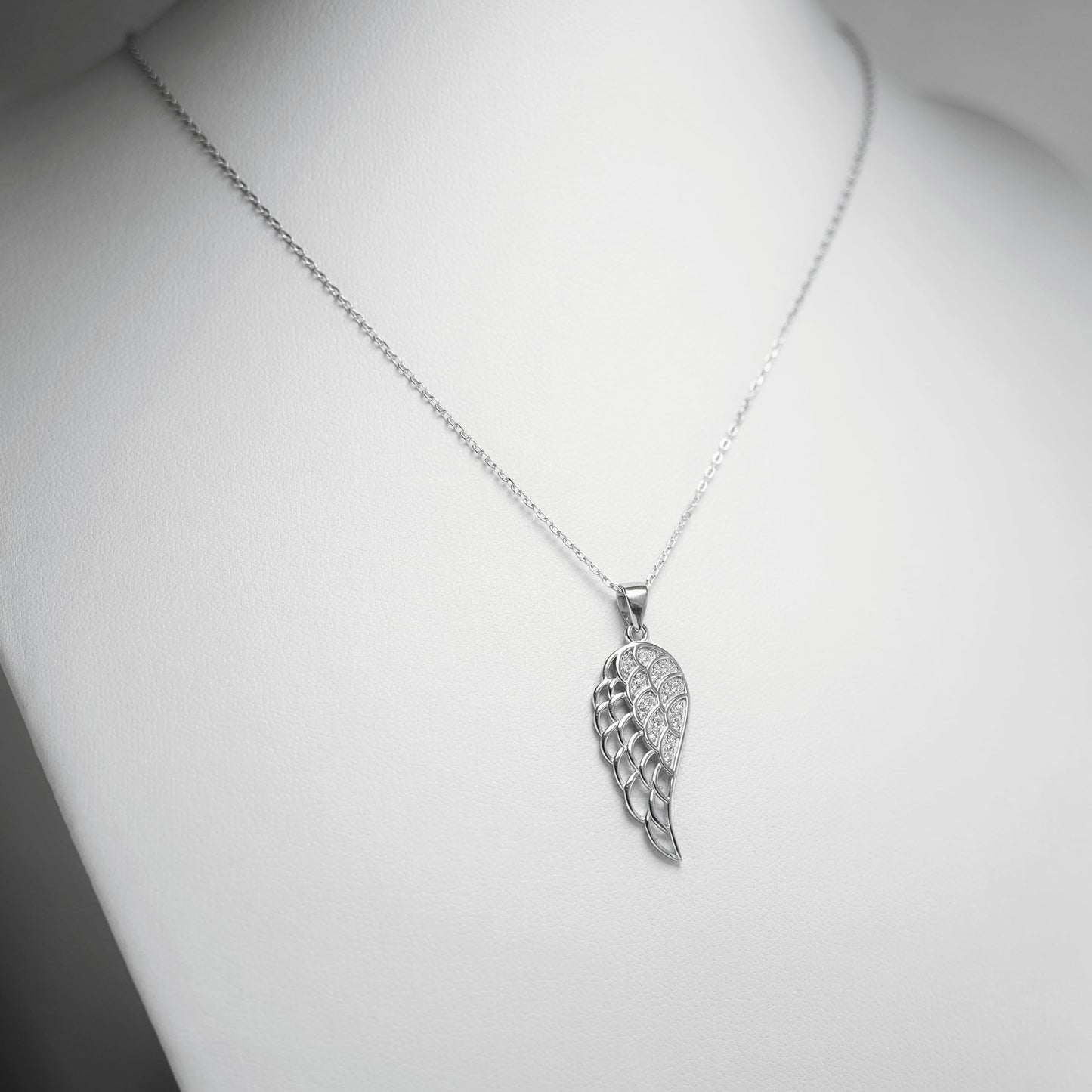 Rhodium curb chain necklace with layered leaf/feather wing pendant