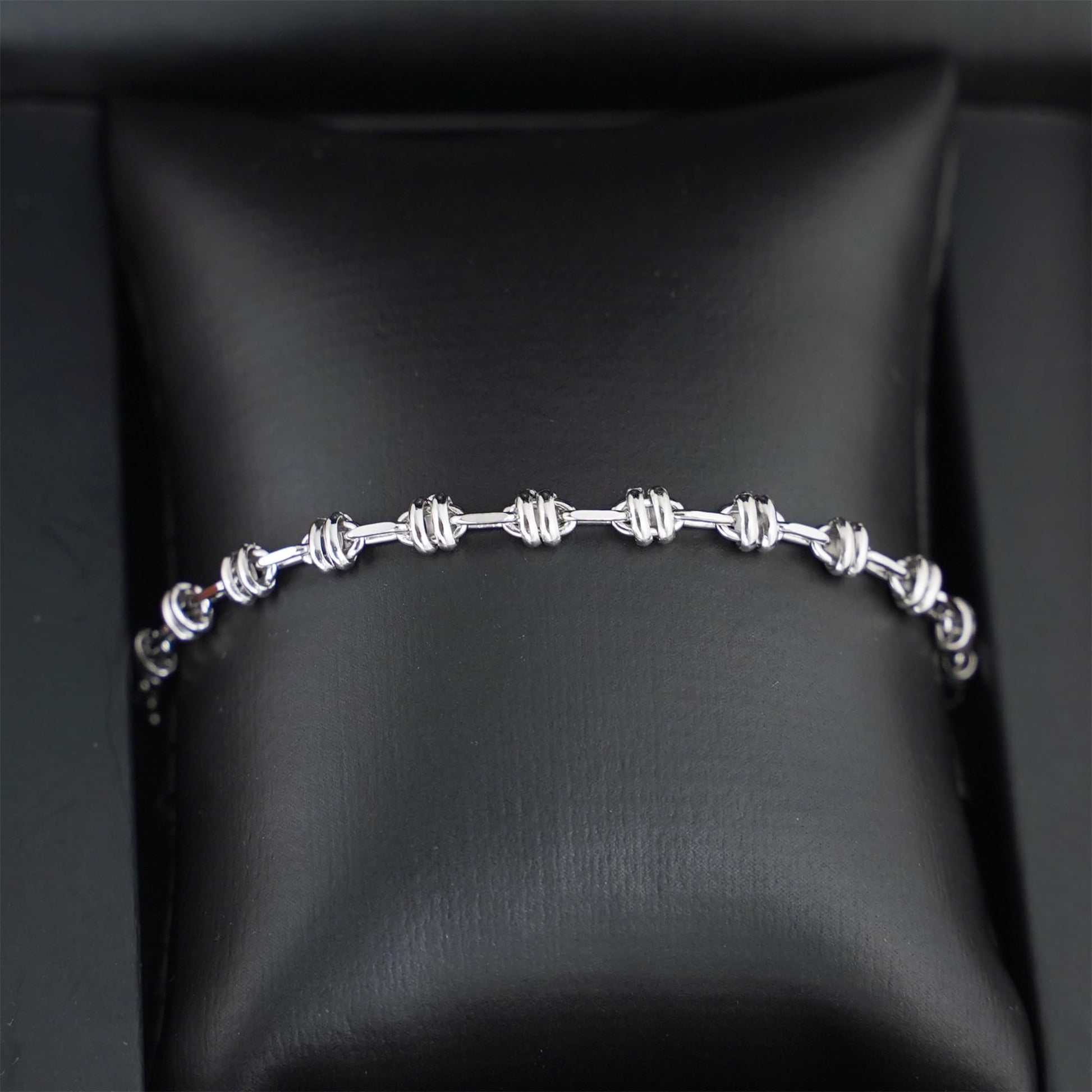 Silver-tone oval rope curb bracelet with repeating oval link segments