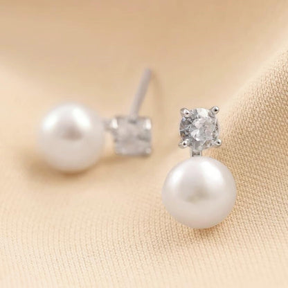 Freshwater Pearl & CZ studs: white pearl with round CZ top setting, back side visible