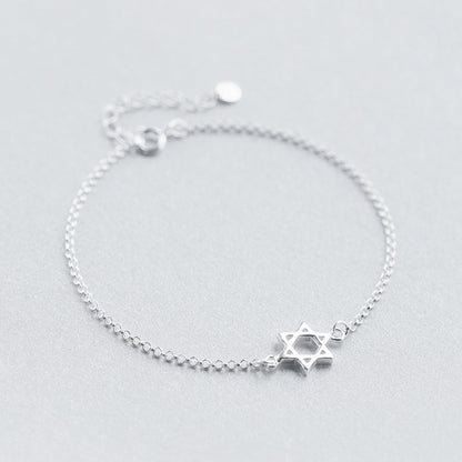 Silver Star of David bracelet with star charm and round clasp at top.