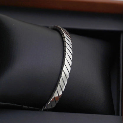 Oxidised rope cuff bangle side profile, twisted rope ridges and dark oxidised edges