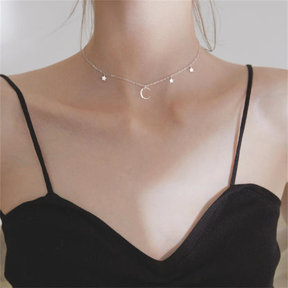 Mini Moon & Star CZ Choker front view on neck: moon charm flanked by stars