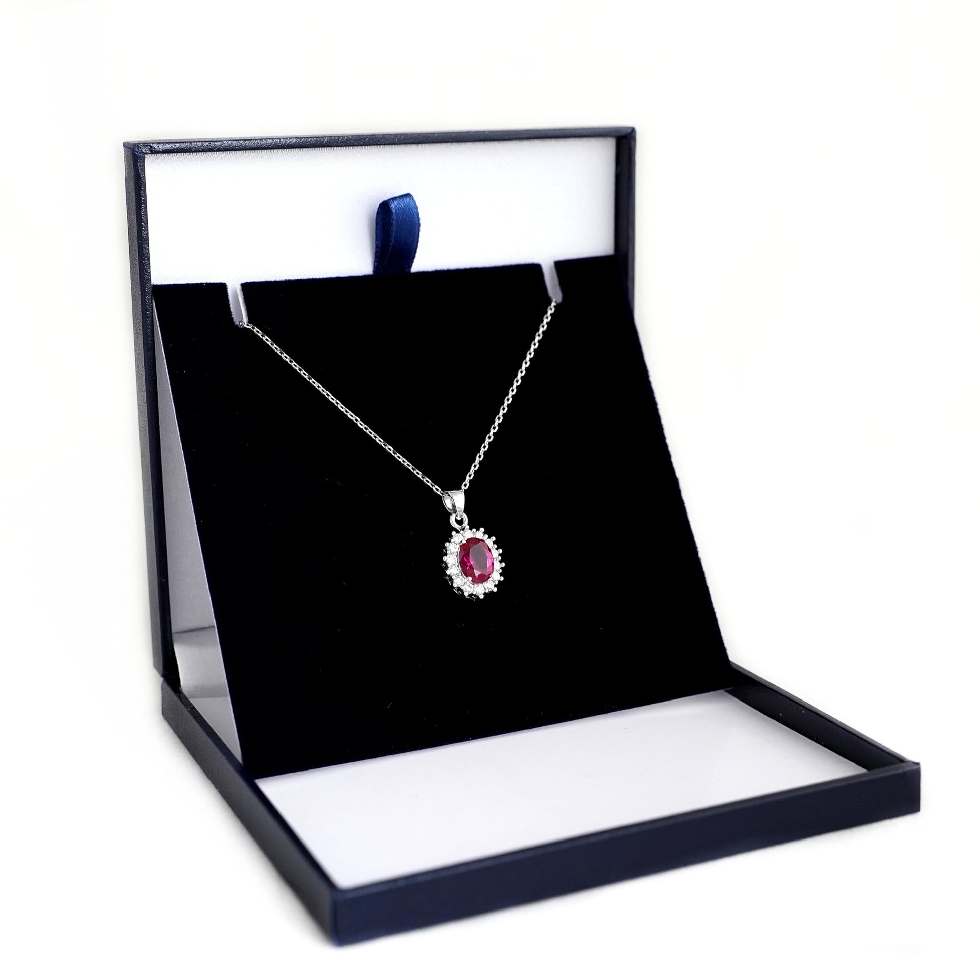 Rhodium curb chain necklace with pink oval gemstone pendant