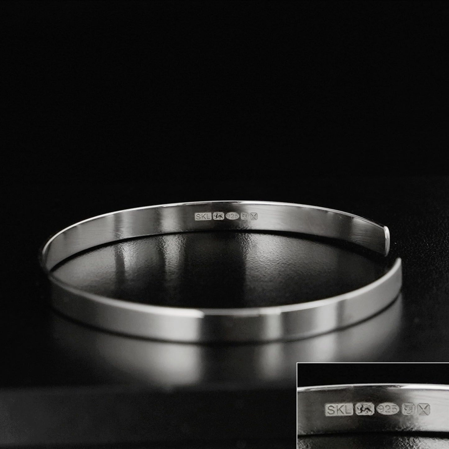 Silver polished cuff bangle with inner hallmark stamps, smooth round profile