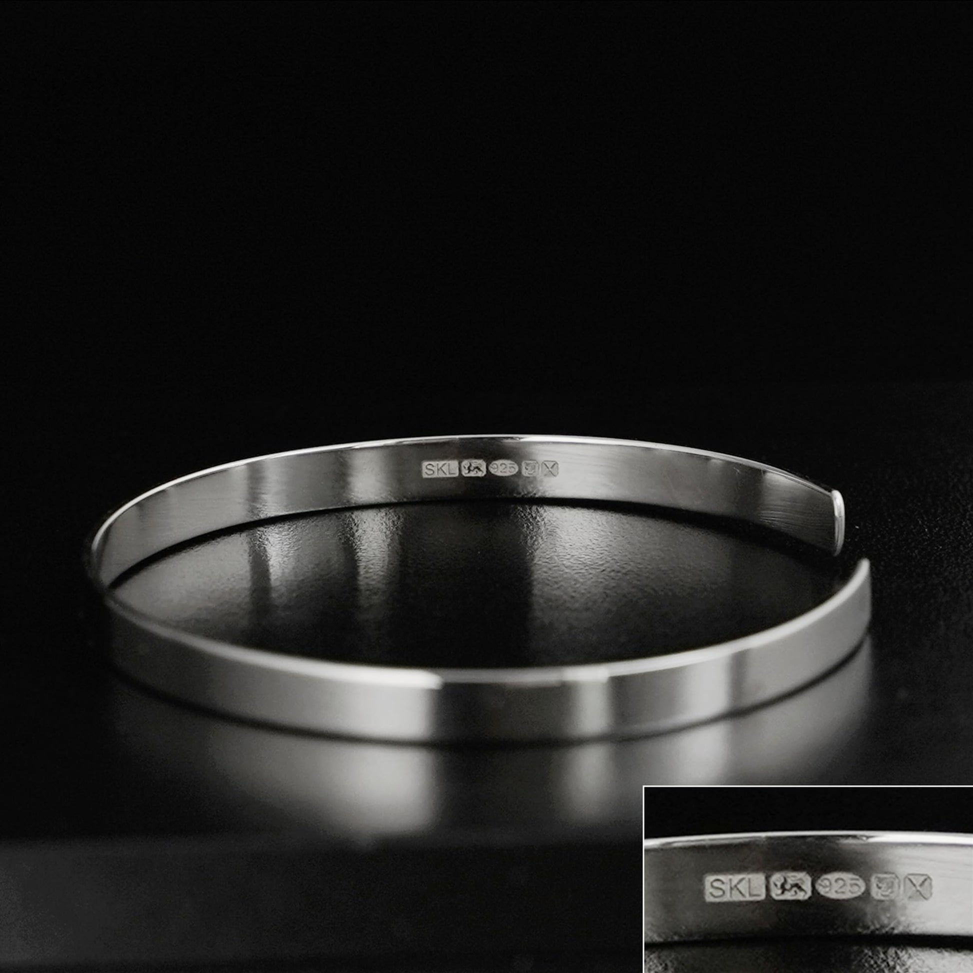 Silver polished cuff bangle with inner hallmark stamps, smooth round profile