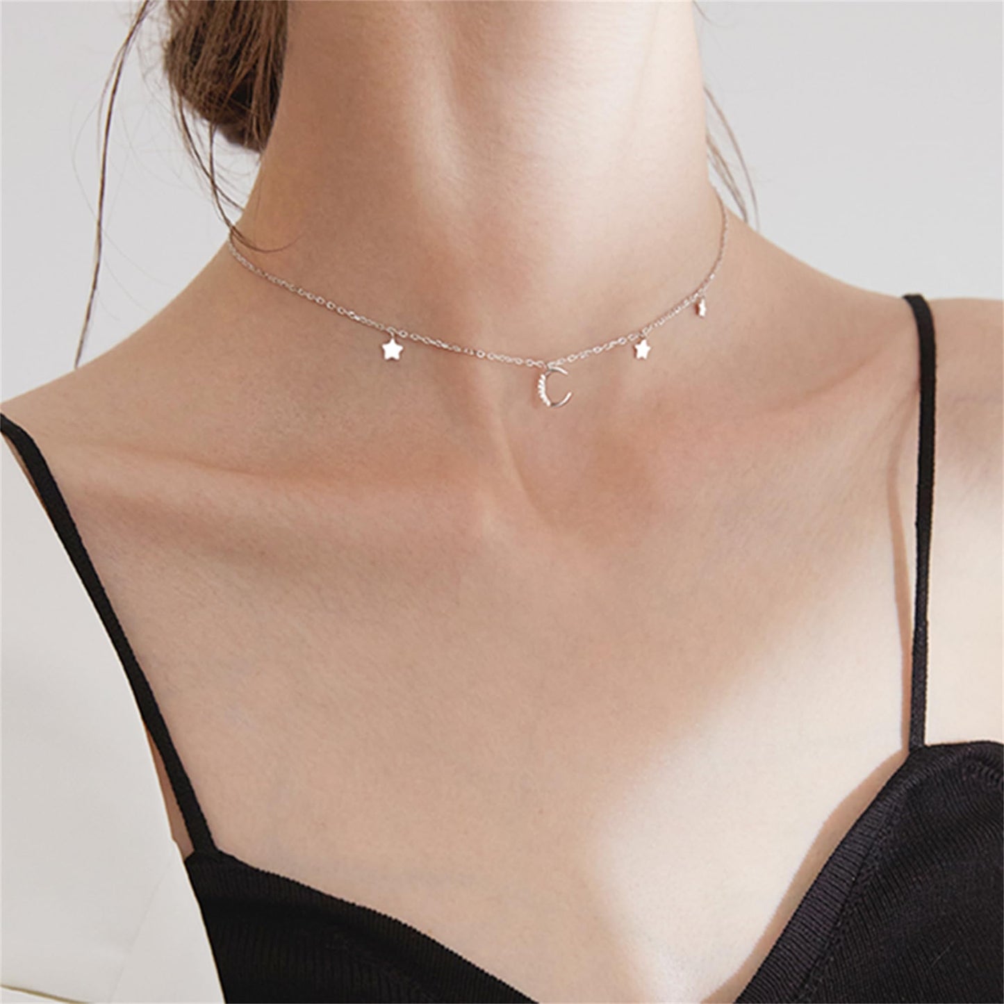 Mini Moon & Star CZ Choker worn on neck: crescent moon and two star charms