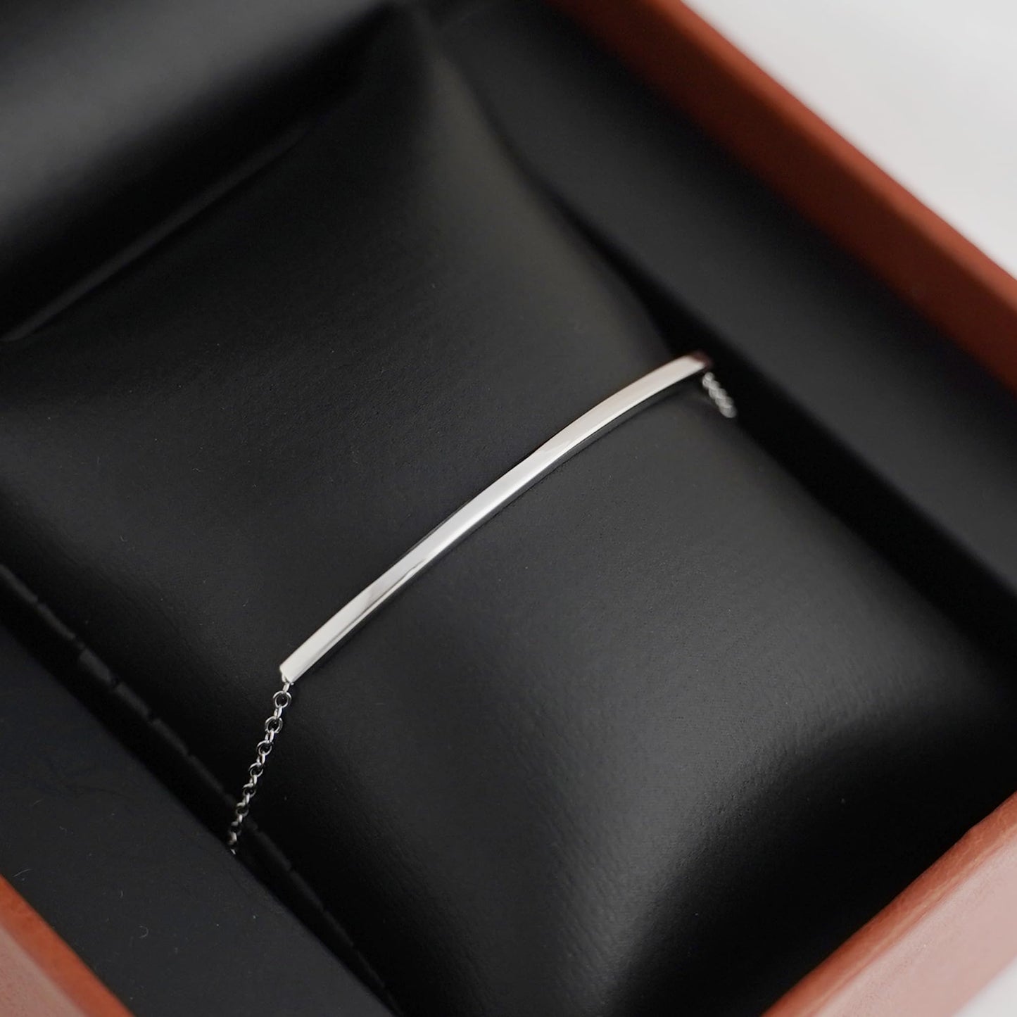 Curved Tube Curb Anklet with slim curved tube bar, curb chain, and small clasp