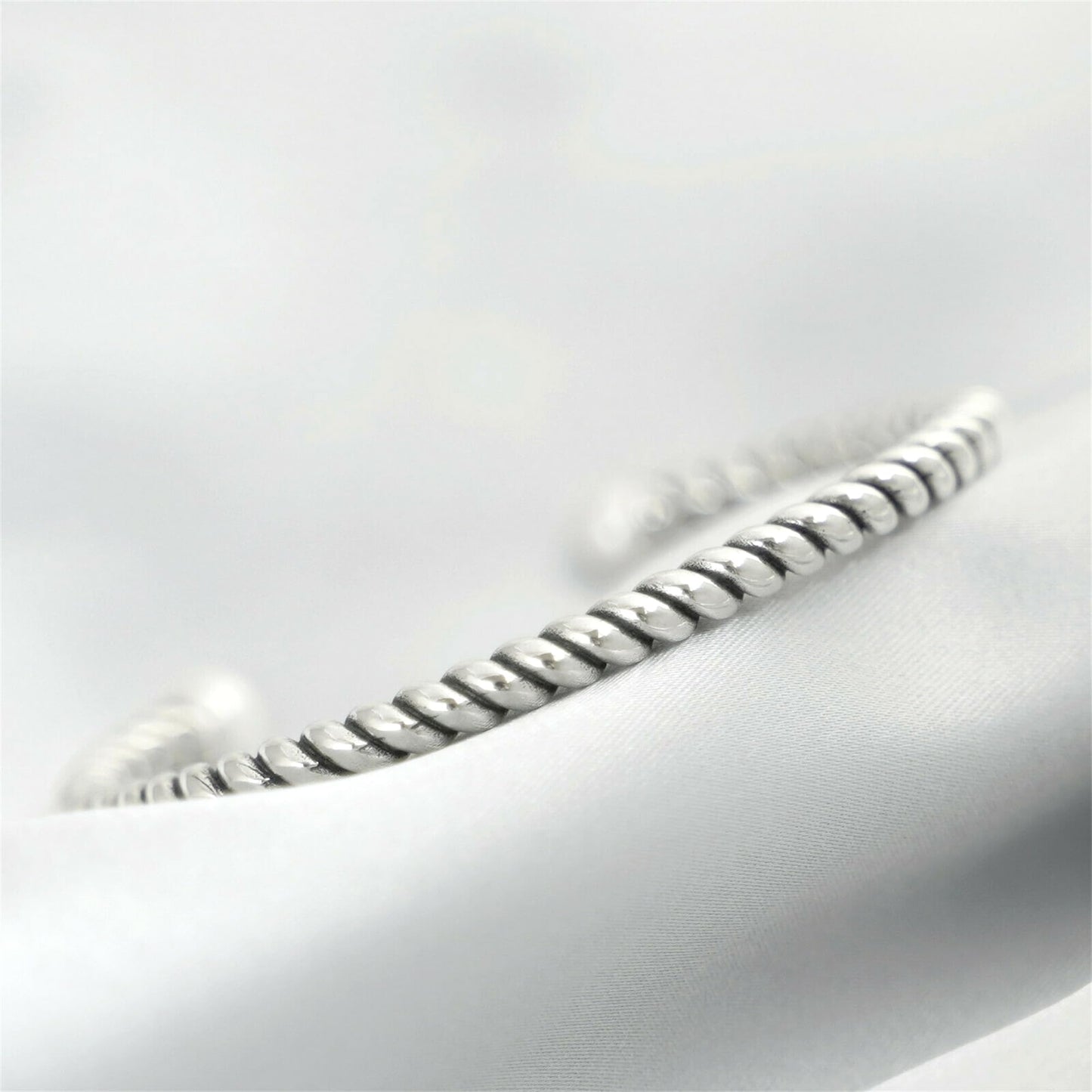 Silver twisted torque bangle with white pearl detail