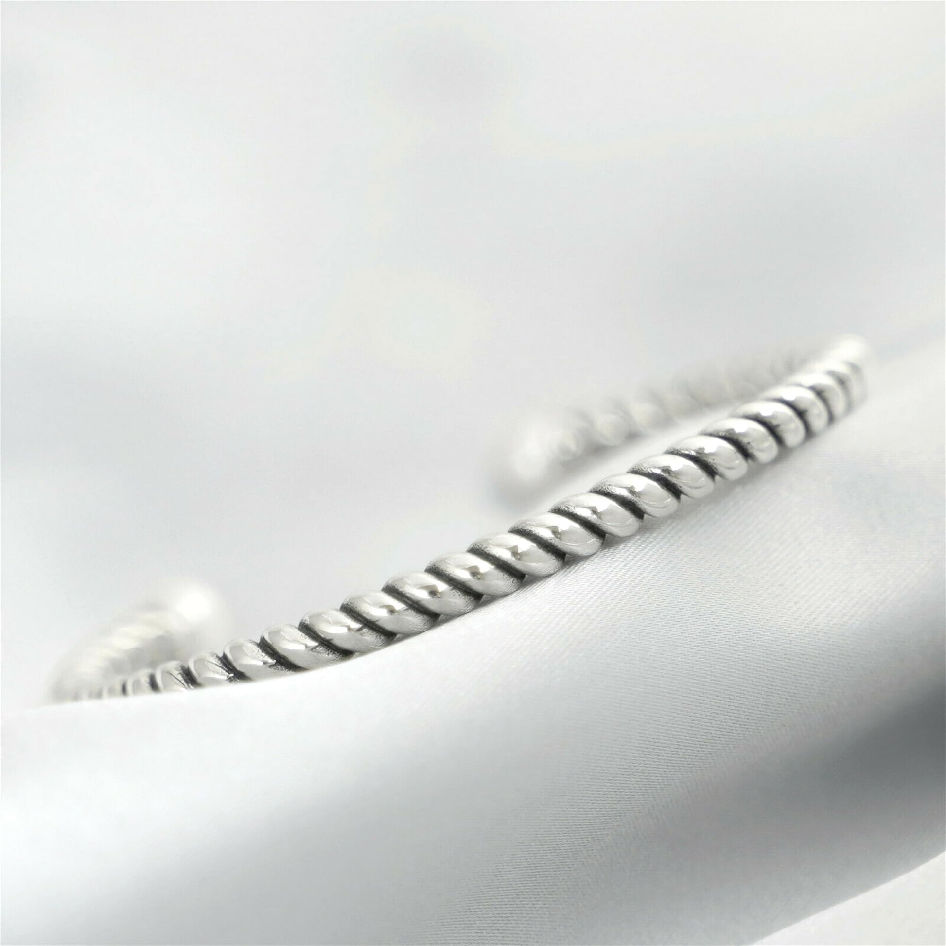 Silver twisted torque bangle with white pearl detail