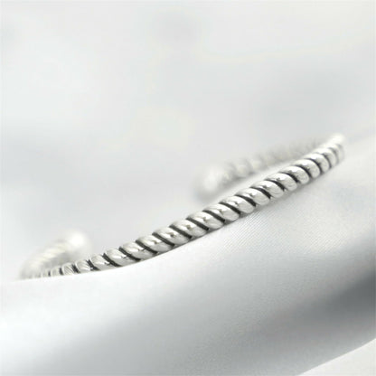 Silver twisted torque bangle with white pearl detail