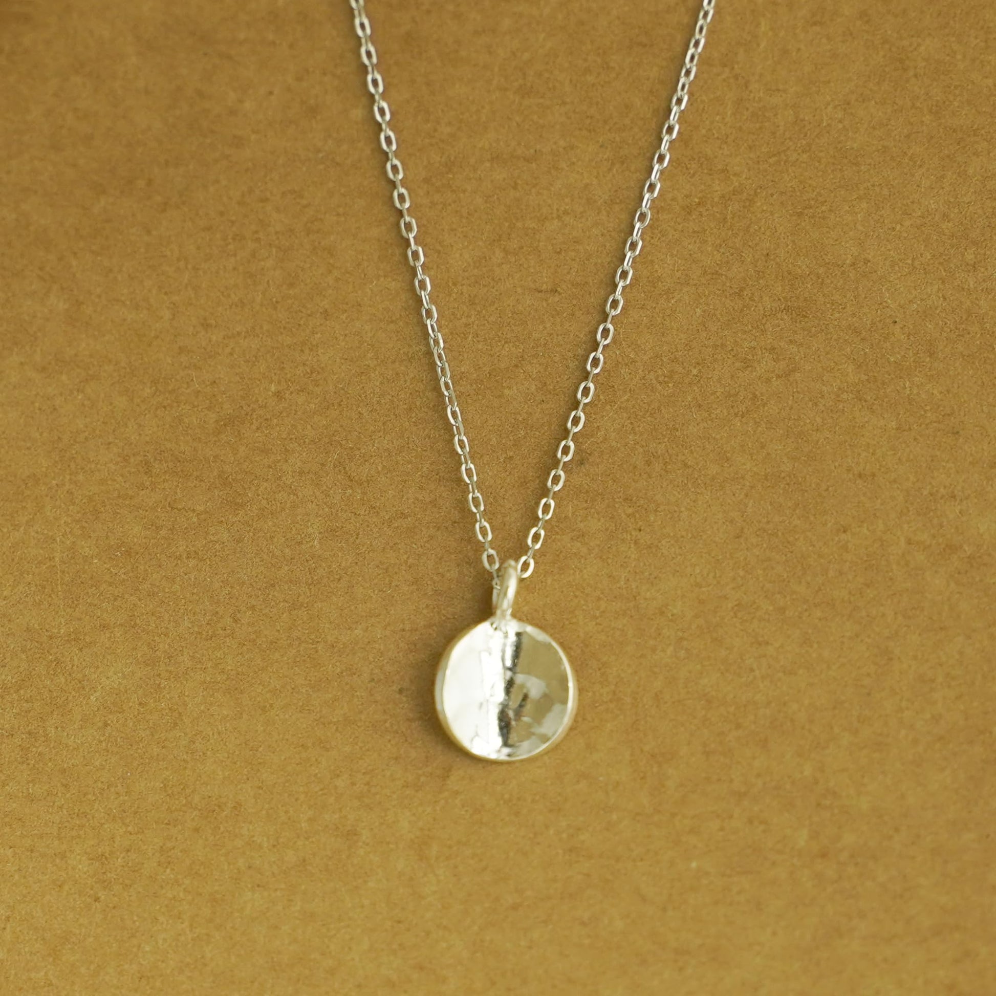 Rhodium curb chain necklace with round mirror-like disc pendant