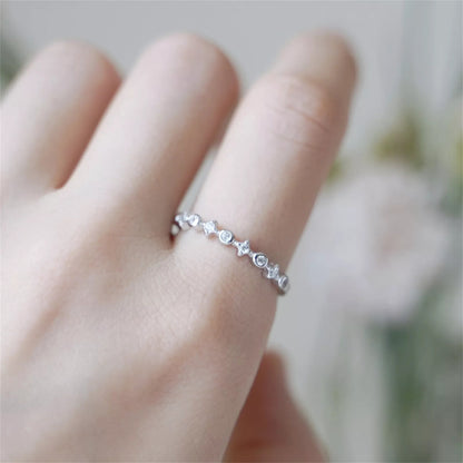 Sterling Silver Bezel-Set CZ Star Band – Adjustable Linked Ring (M–Q)