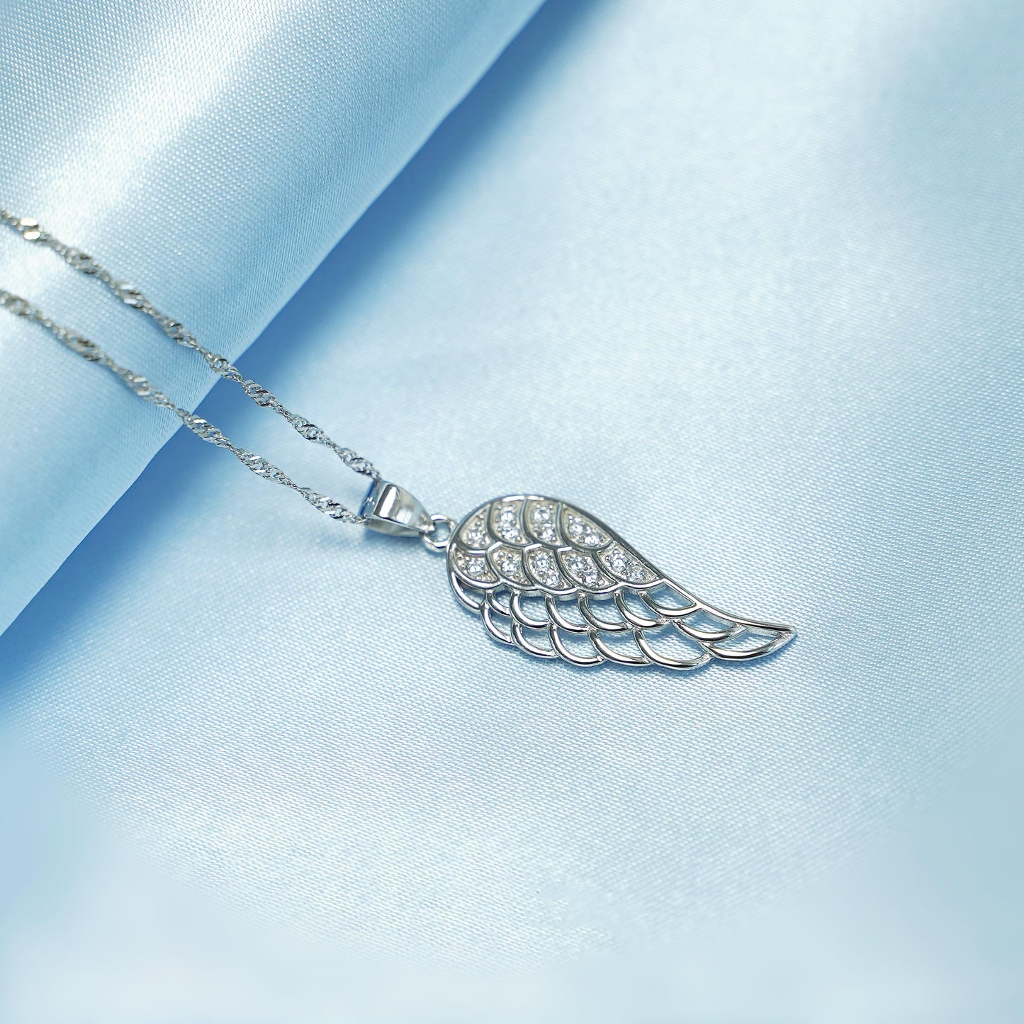 Rhodium twisted chain with embellished angel-wing pendant