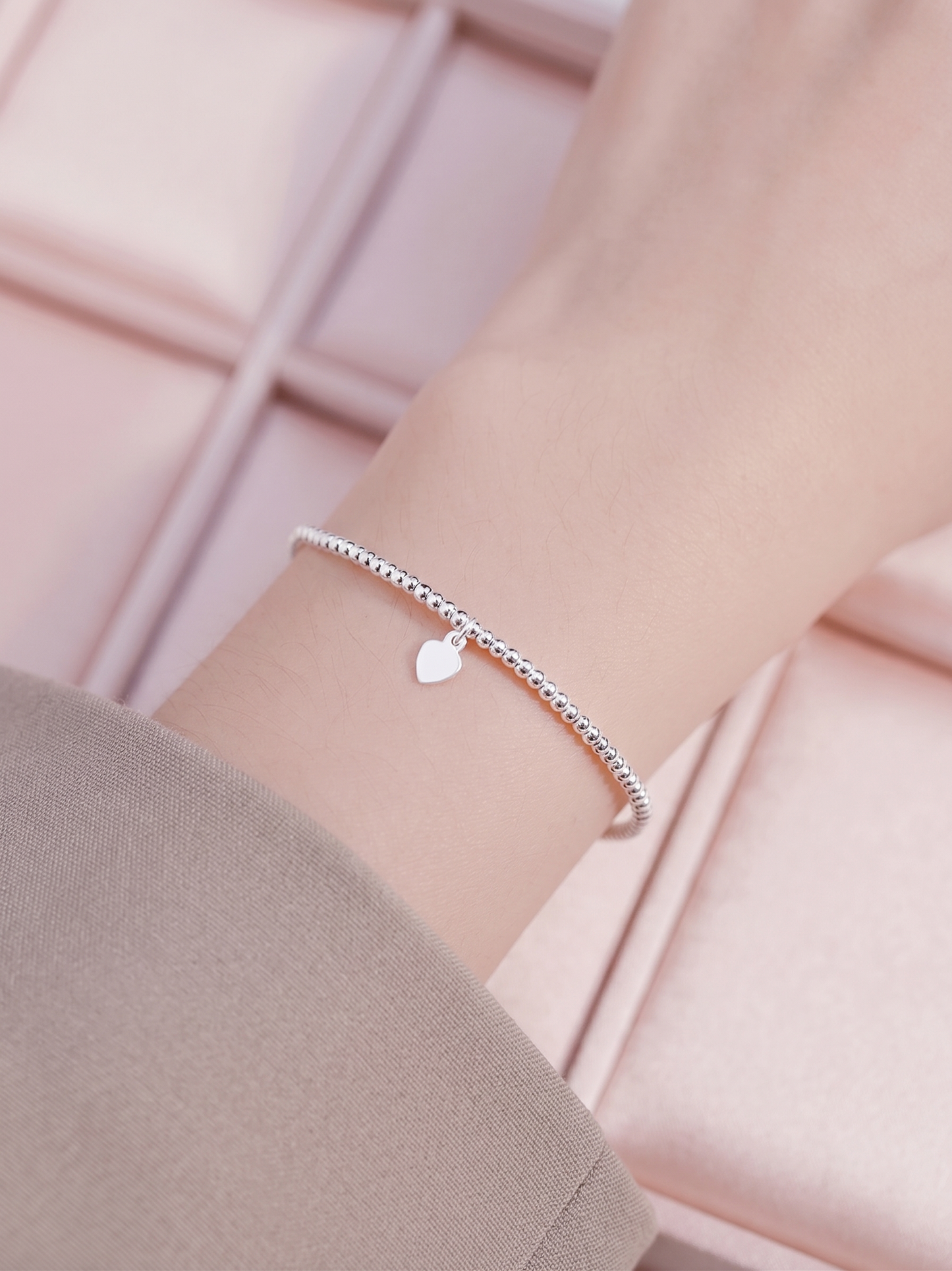 Silver bead stretch bracelet with small heart charm and slim curved bar