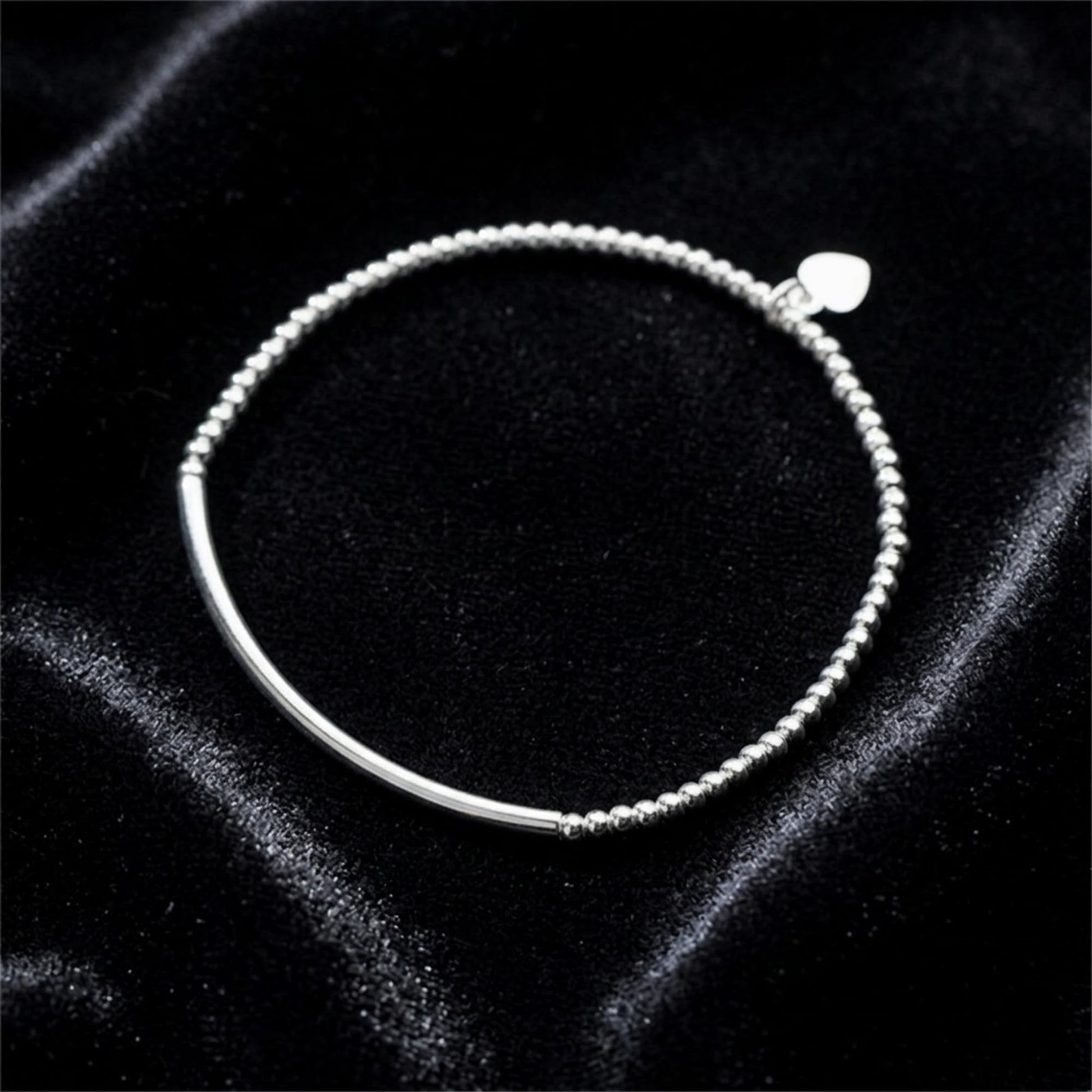 Silver stretch bracelet with heart charm and round bead chain with curved bar