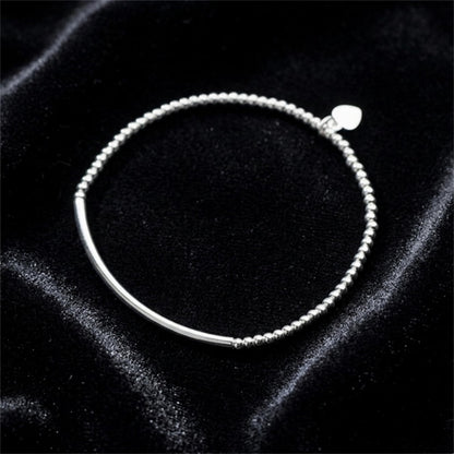 Silver stretch bracelet with heart charm and round bead chain with curved bar