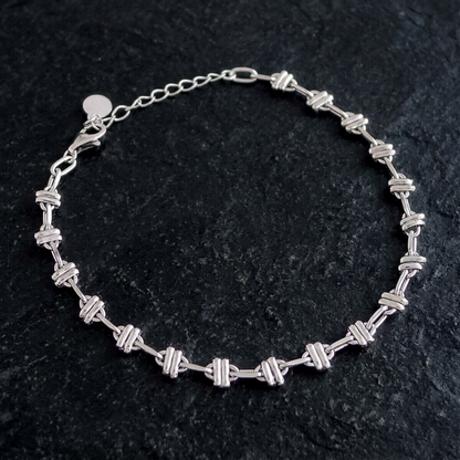 Oval rope curb bracelet with repeating oval link bars in silver-tone