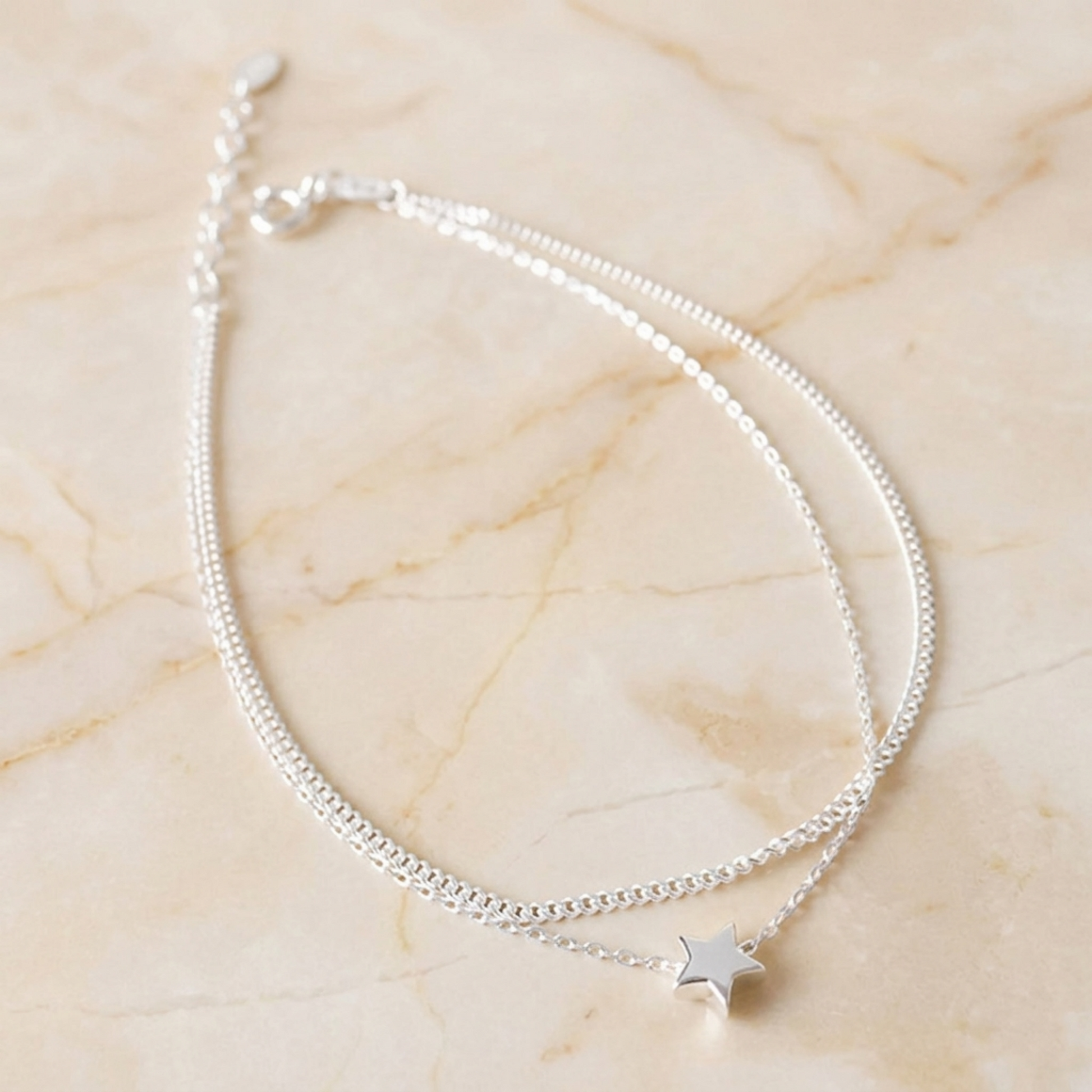 Double-layer star anklet with small star charm on silver-toned chains