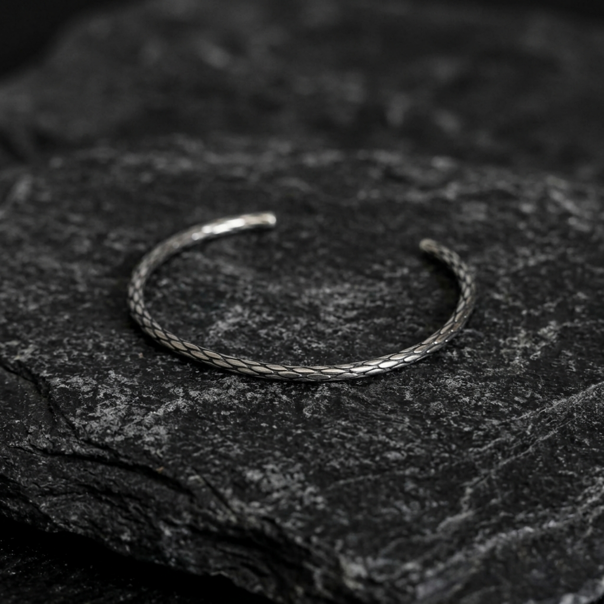 Snake knot cuff bangle close-up, braided snake-knot design open circle