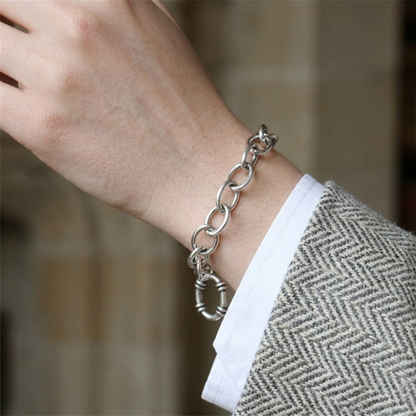 Oxidised T-bar bracelet on wrist with oval chain links and hoop charm