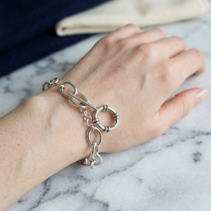 Oxidised T-bar bracelet on hand with oval chain links and hoop charm