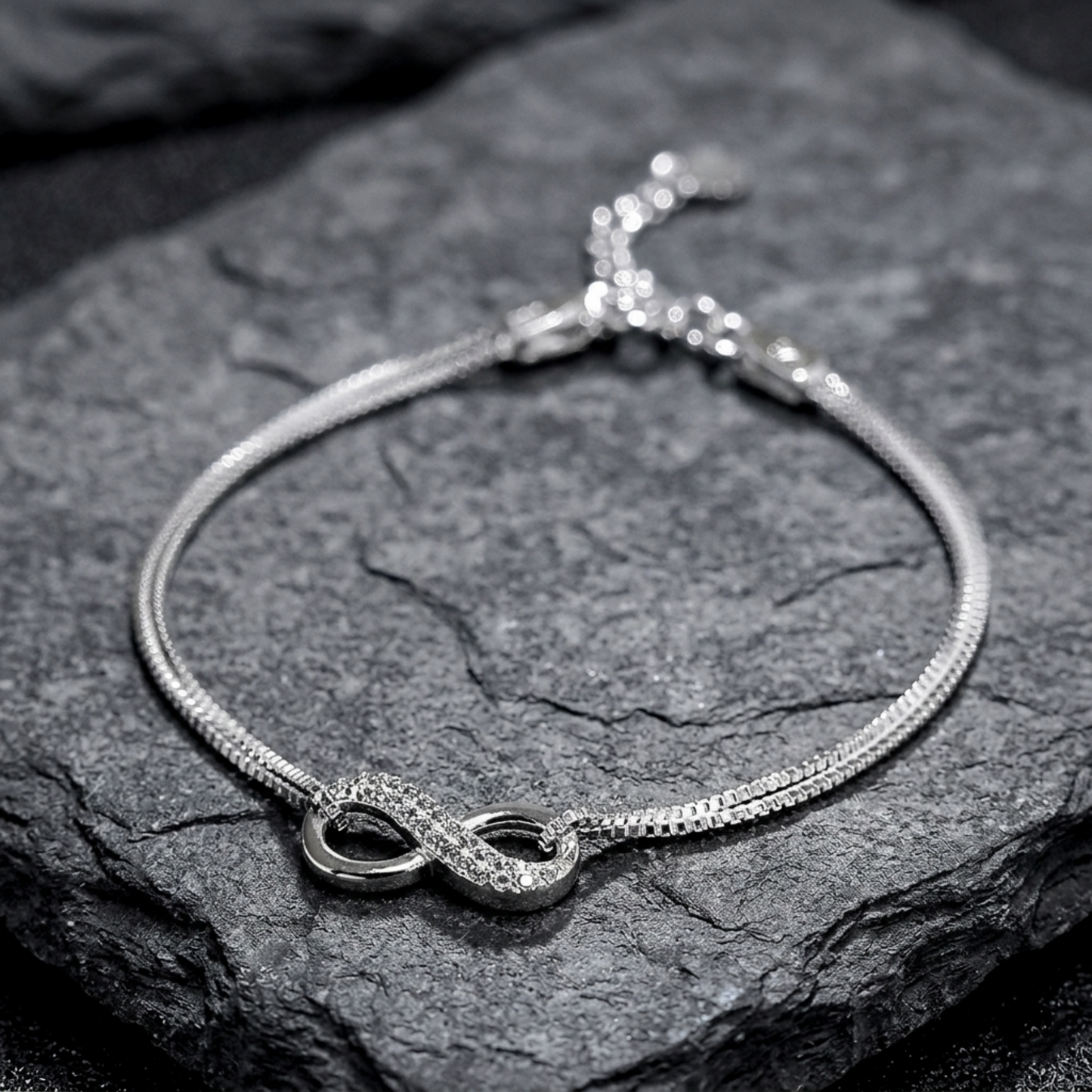 CZ Infinity bracelet: textured infinity loops with small oval bezel accents