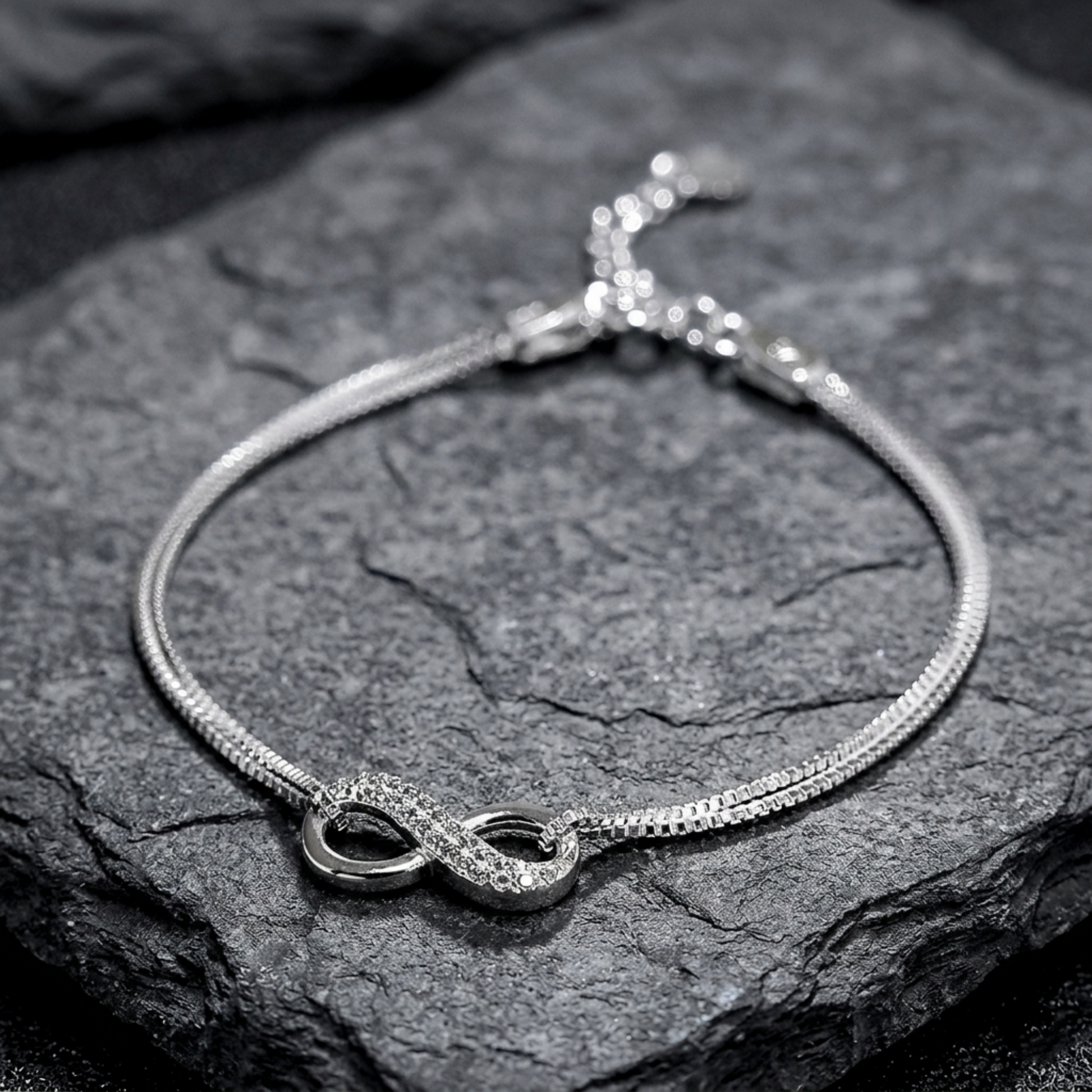 CZ Infinity bracelet: textured infinity loops with small oval bezel accents