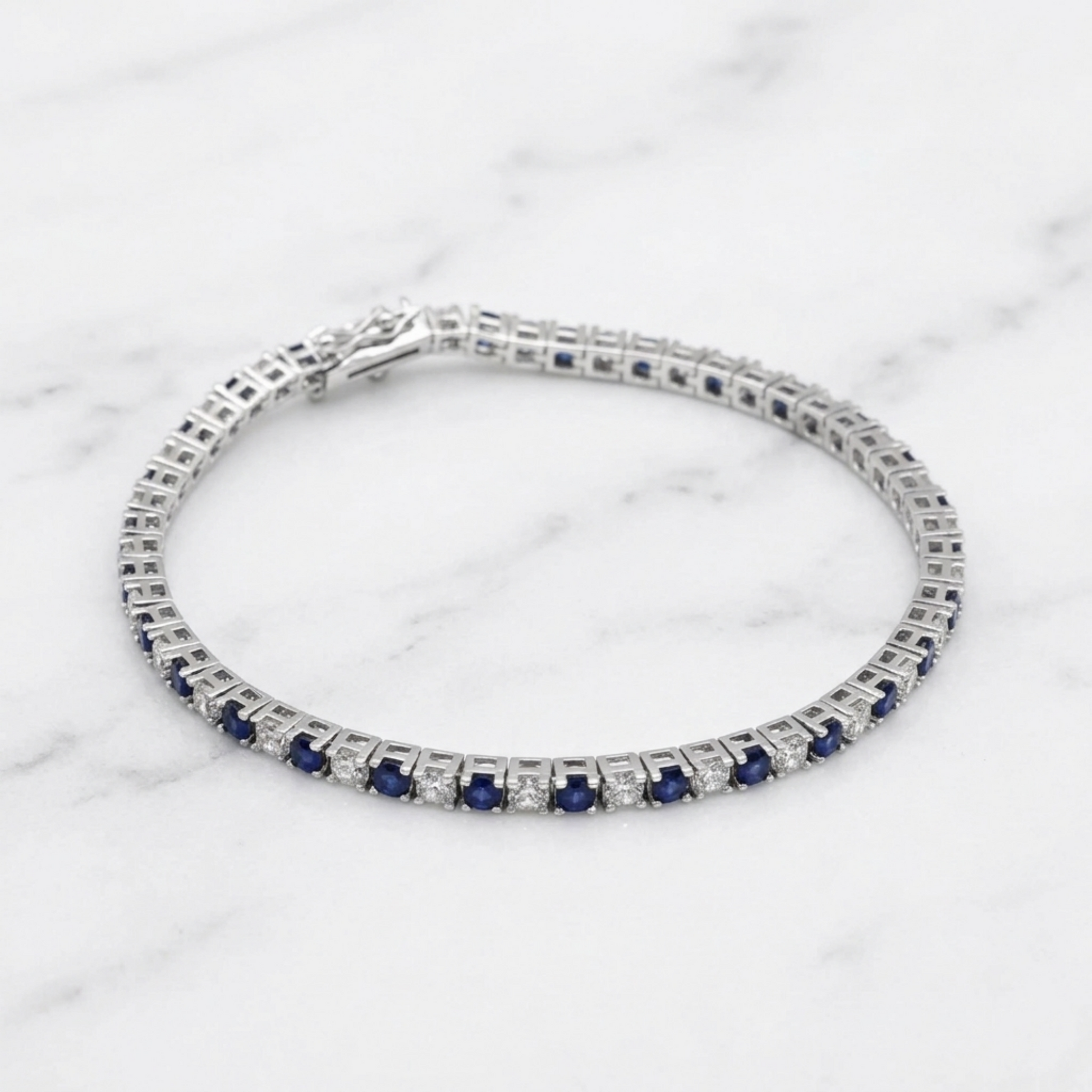 Sapphire tennis bracelet bracelet stack view with blue stones and clear diamond accents