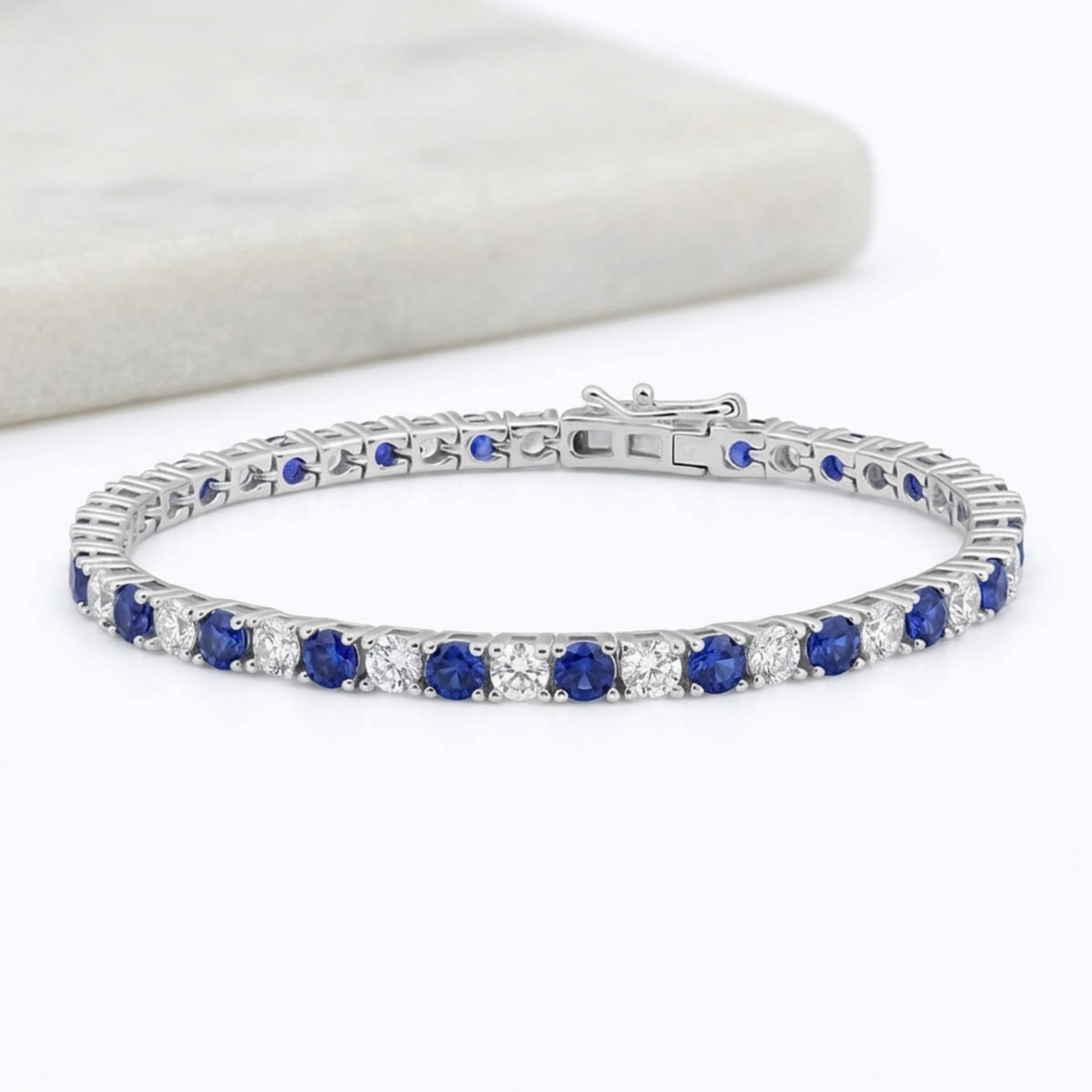BISELTD sapphire tennis bracelet featuring blue stones with sparkling clear details