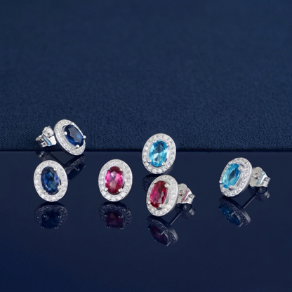 Silver-tone oval CZ halo stud earrings with blue and pink oval stones