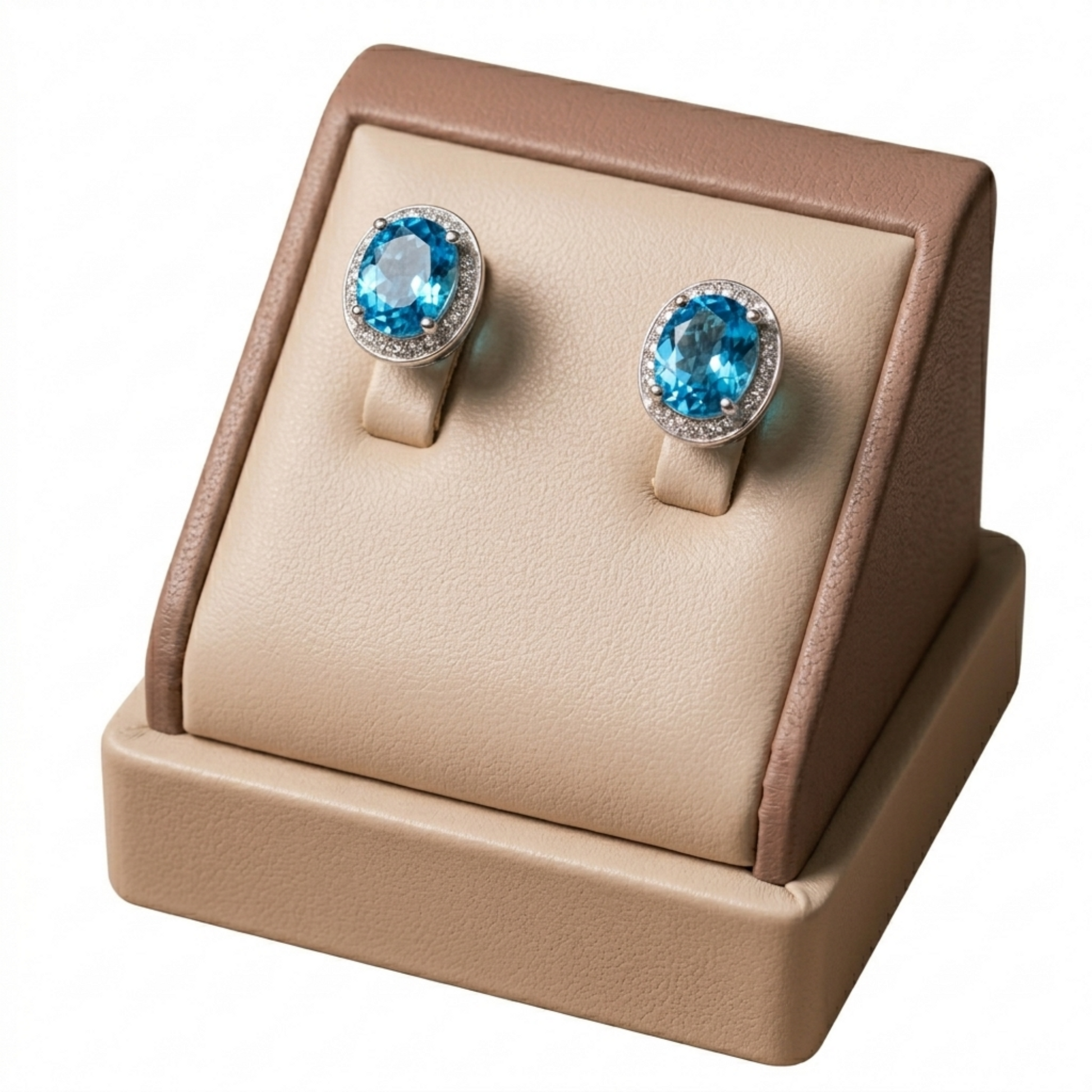 Blue topaz CZ halo stud earrings on post: oval light-blue stone with clear halo border.