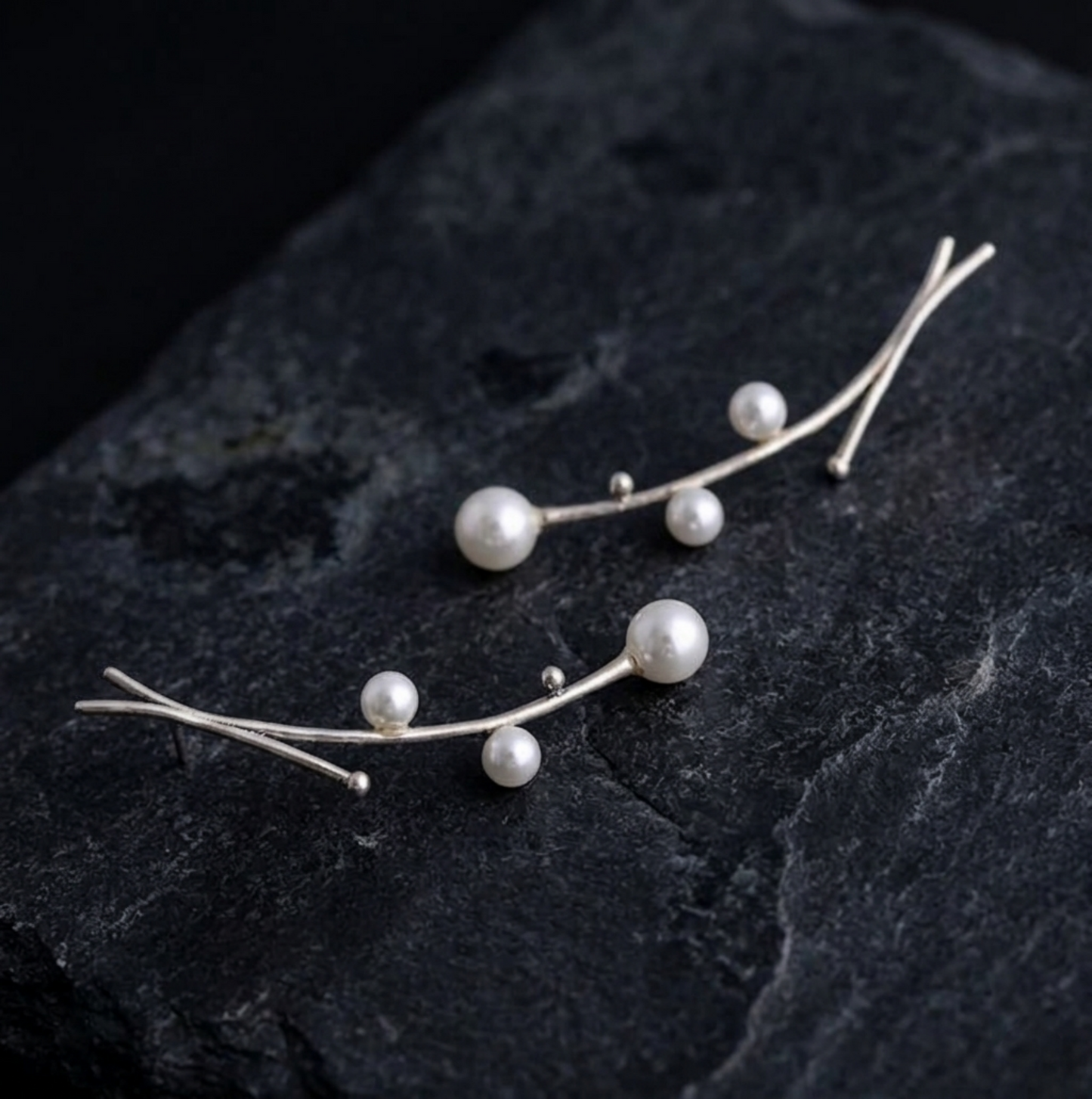 Gold-tone mistletoe drop earrings with white pearls and slim curved bars