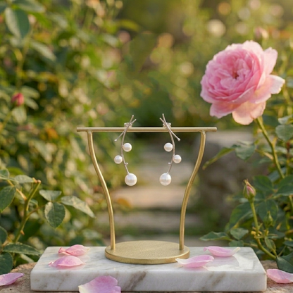Mistletoe drop earrings display: curved hooks with dangling white pearls