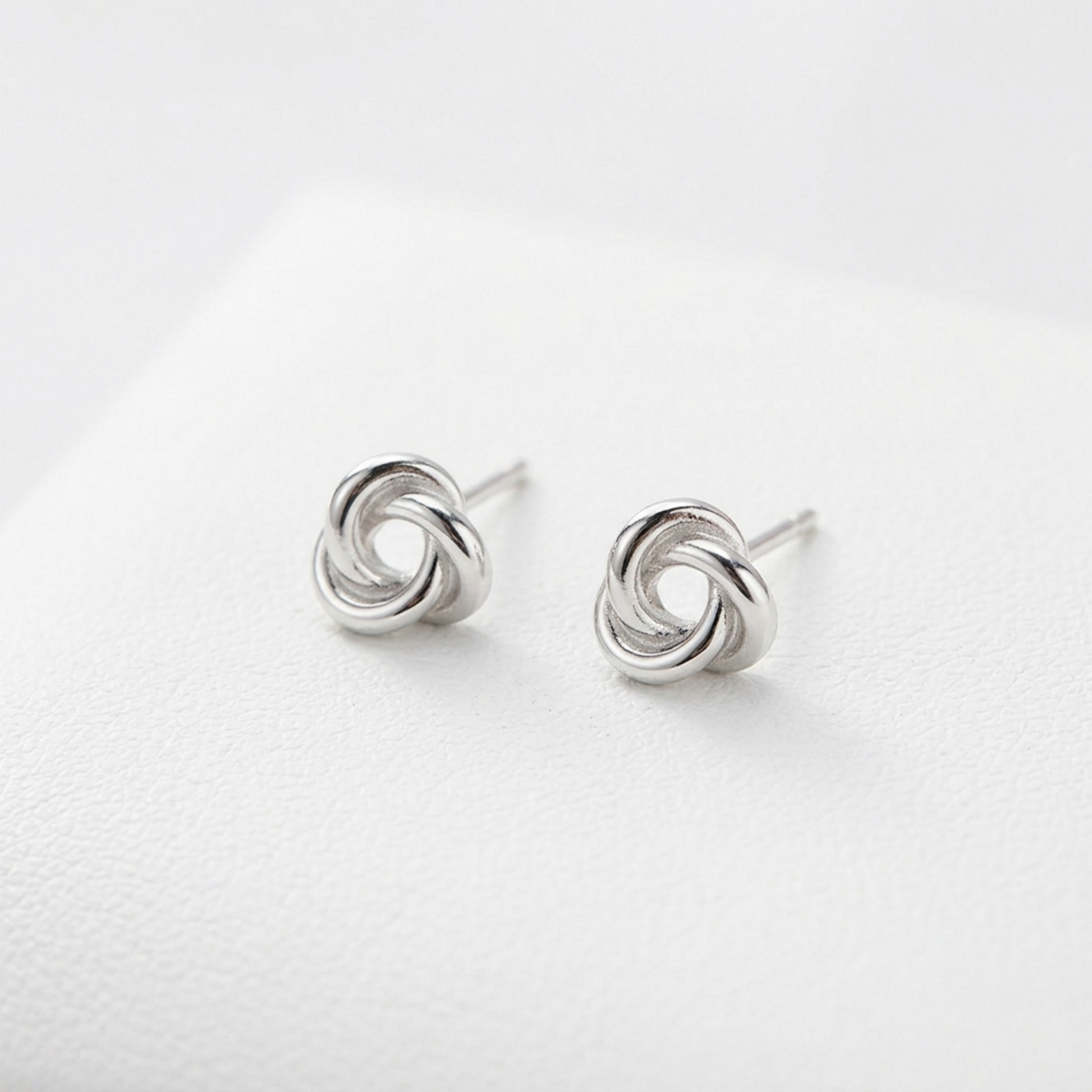 Pair of silvertone Celtic Trinity knot stud earrings with pin posts