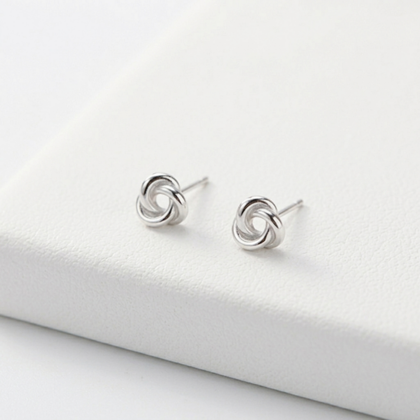 Celtic Trinity knot studs, silvertone round swirl motif on metal posts