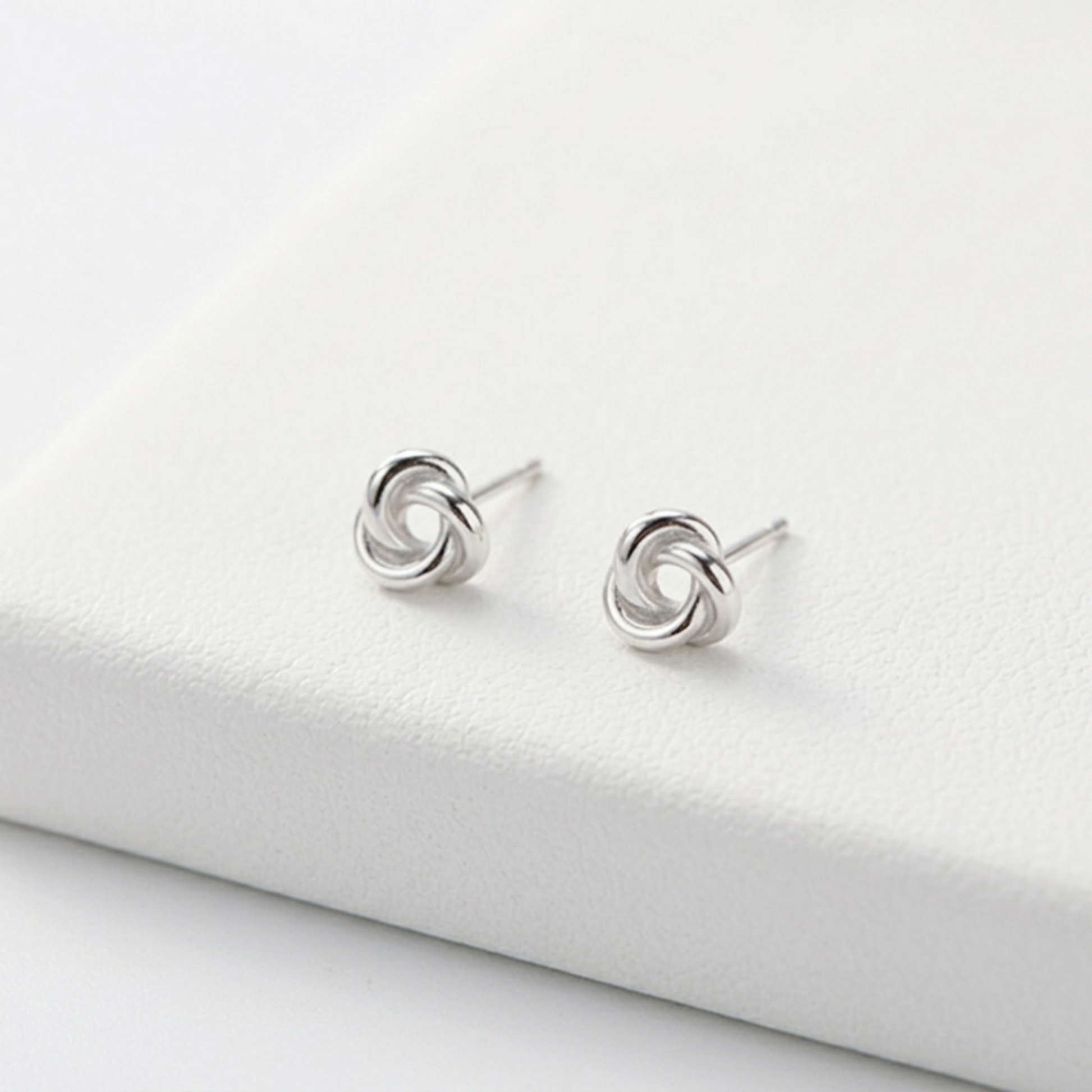 Celtic Trinity knot studs, silvertone round swirl motif on metal posts