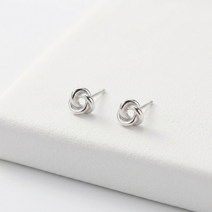 Celtic Trinity knot studs, silvertone round swirl motif on metal posts
