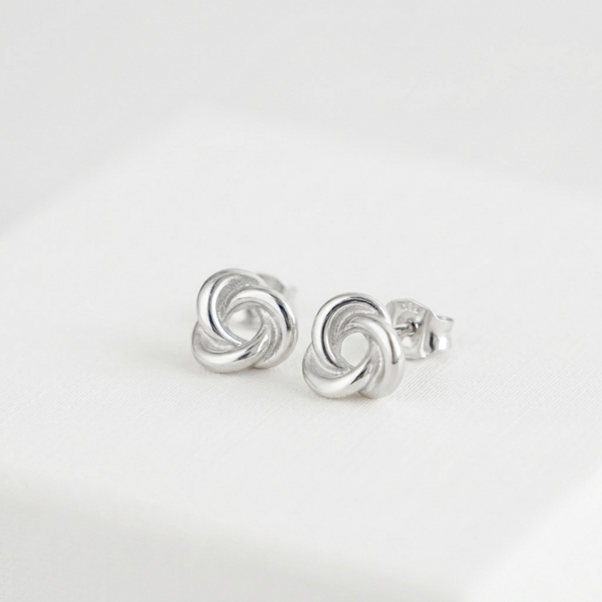 Celtic Trinity knot stud earring with butterfly back, silvertone swirl design