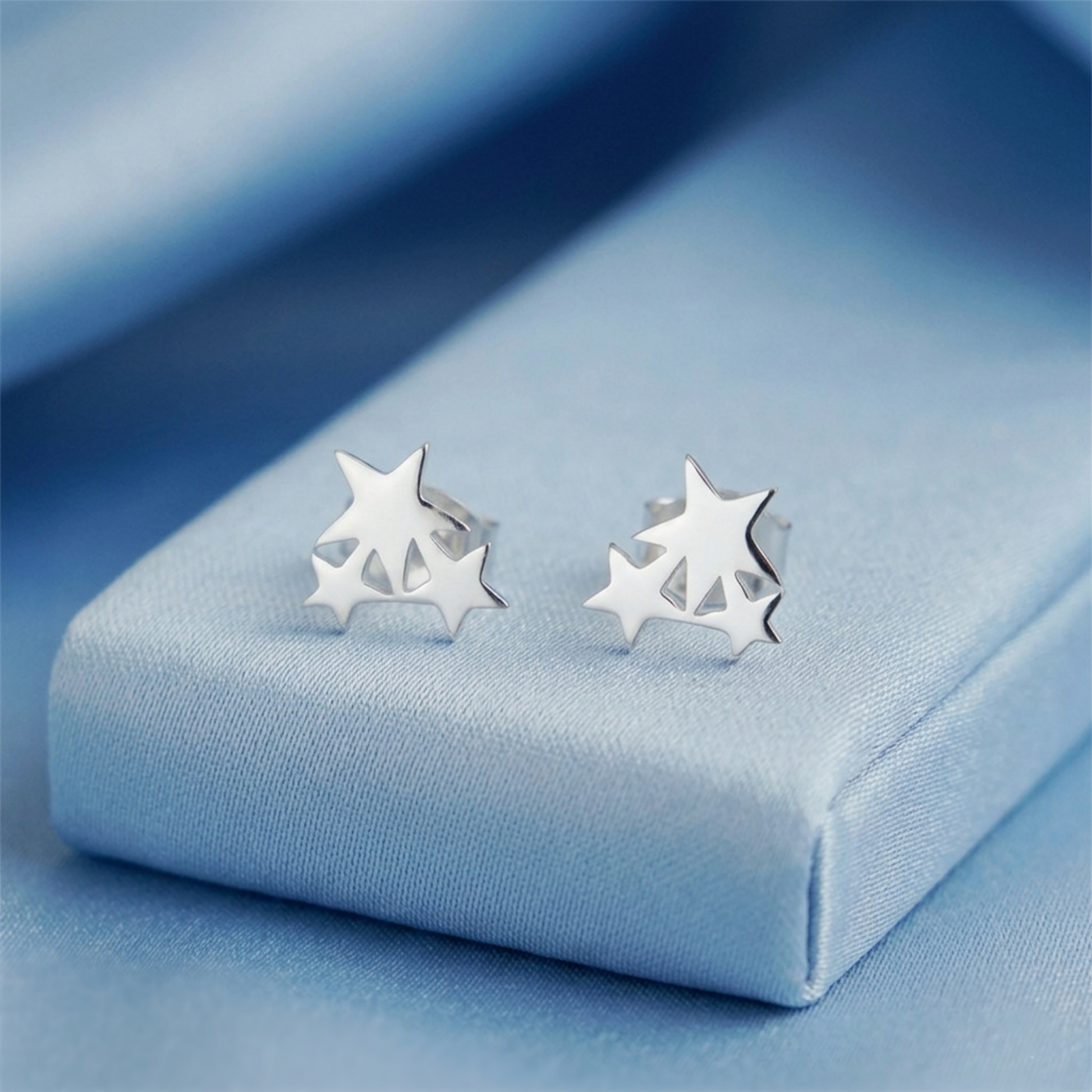 Triple Star stud earrings, three stacked stars detail in silver-tone