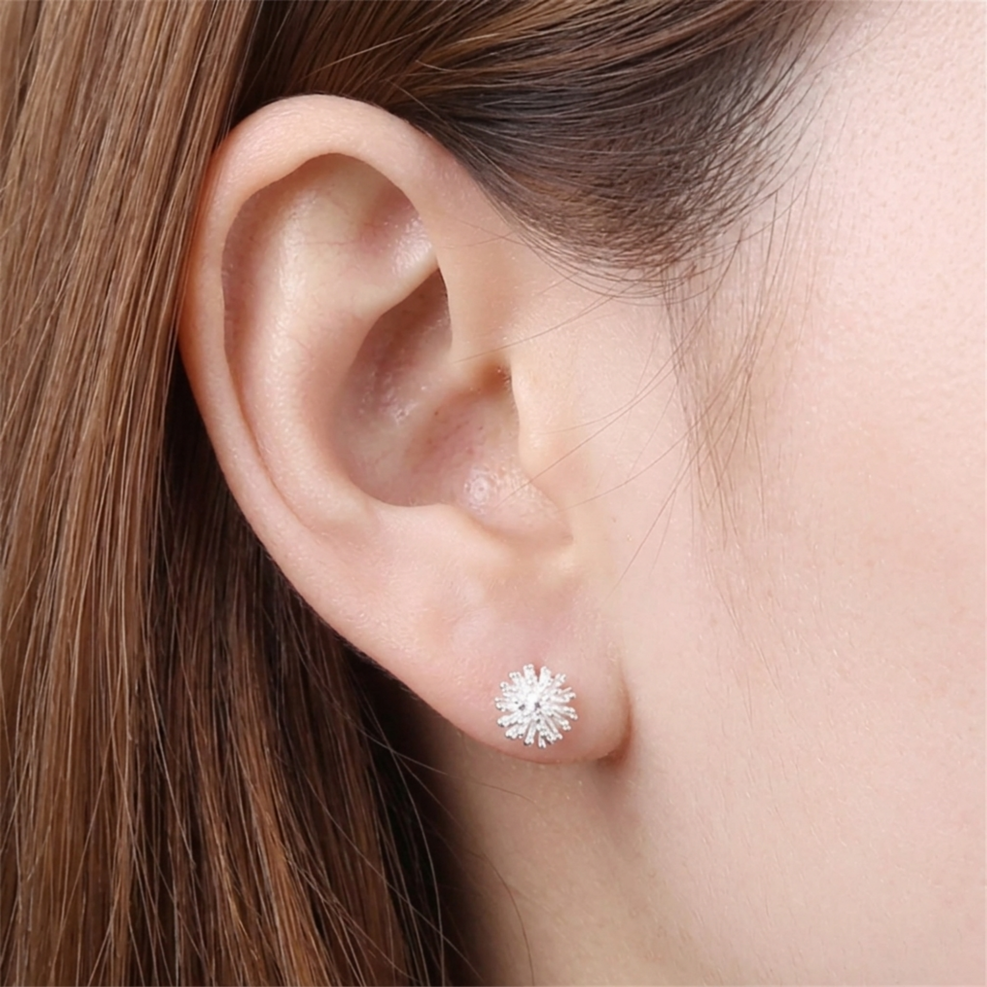 Dandelion flower stud earring on ear, silver-tone crystal dandelion stud