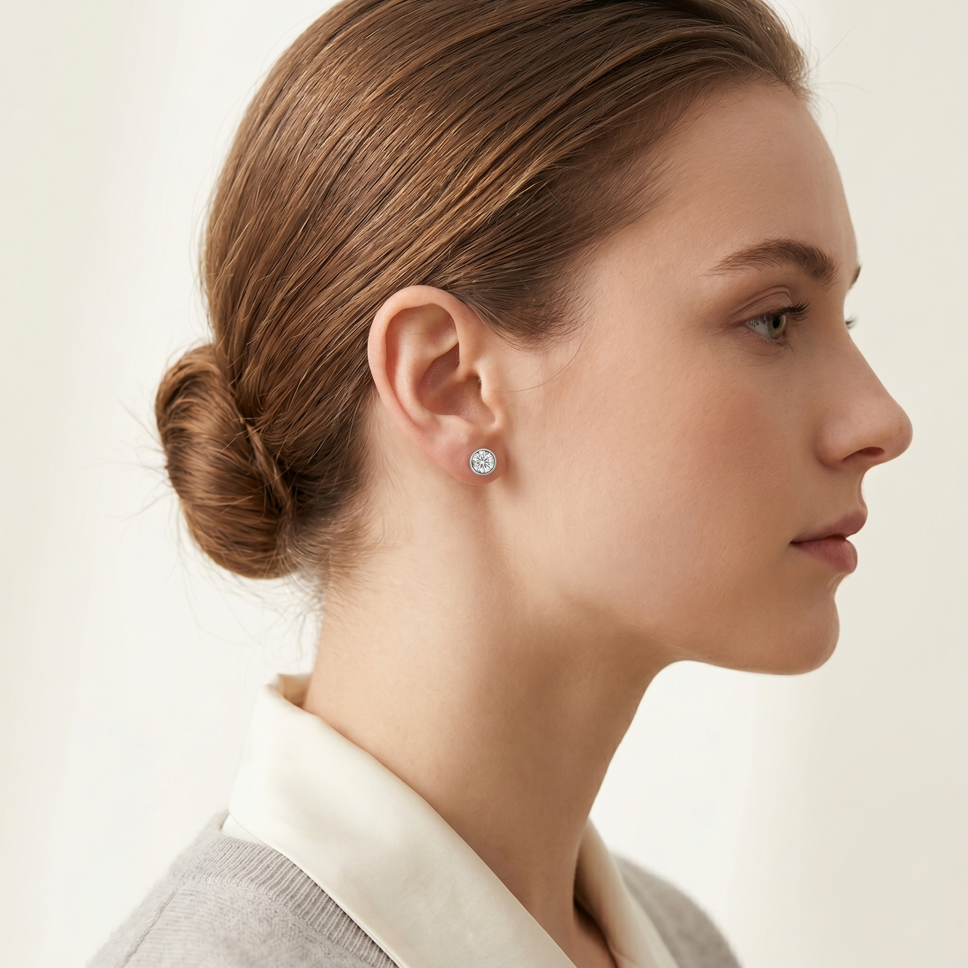 Bezel Solitaire Studs with round clear center stone in a silver bezel setting