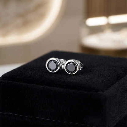 Black bezel solitaire stud earrings, round dark stone with circular silver-tone bezel