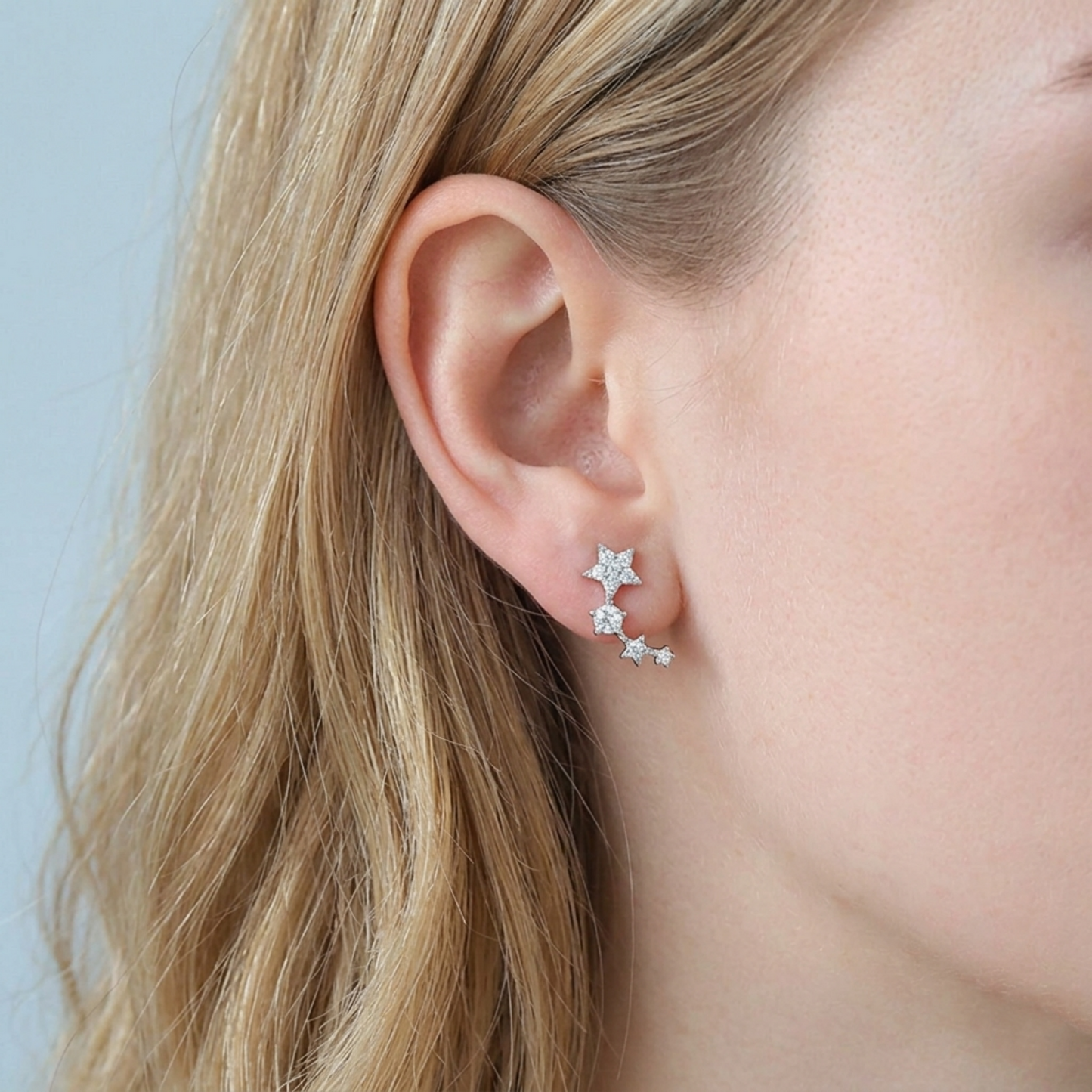 Star CZ ear climbers worn on ear: dangling linked star chain with CZ stones