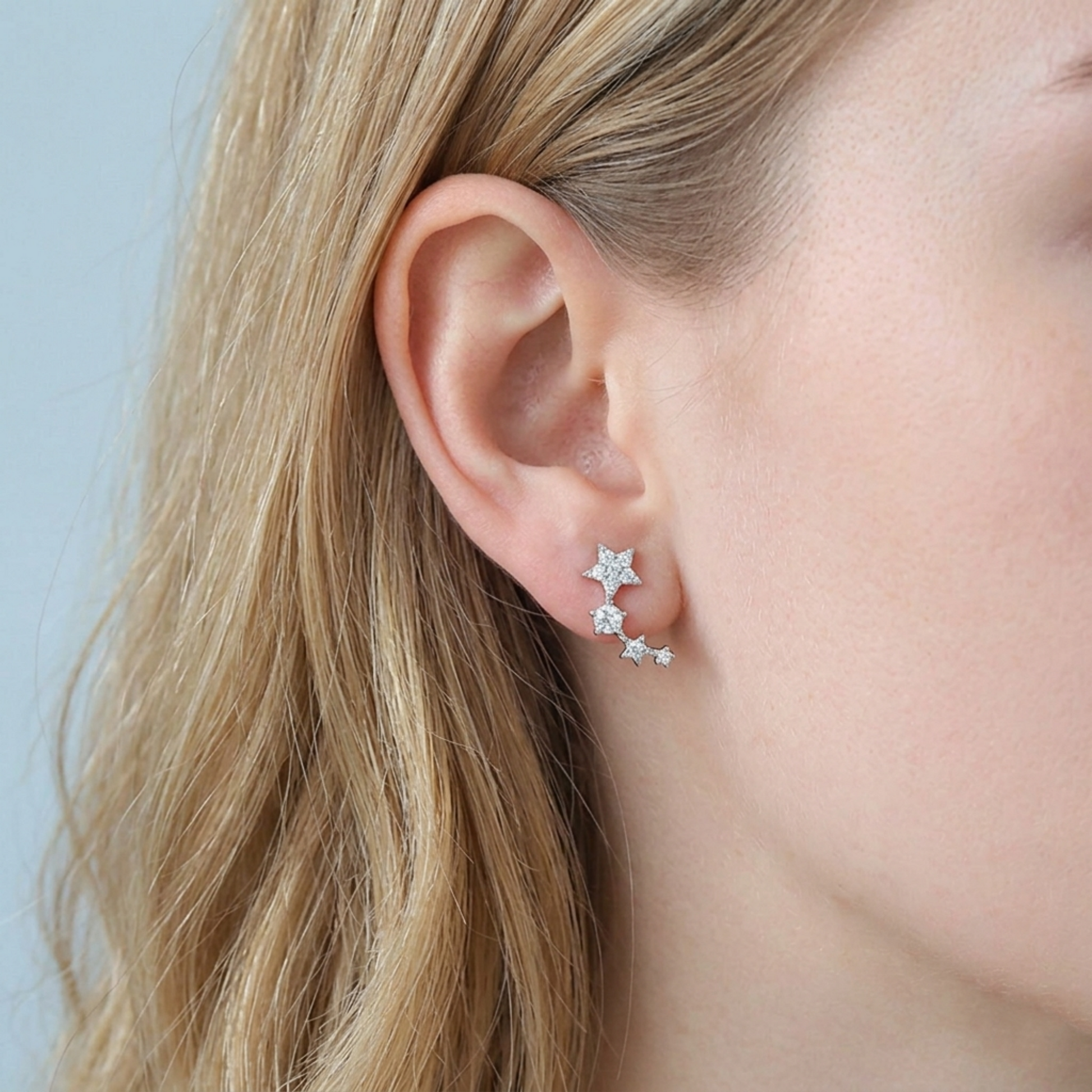Star CZ ear climbers worn on ear: dangling linked star chain with CZ stones