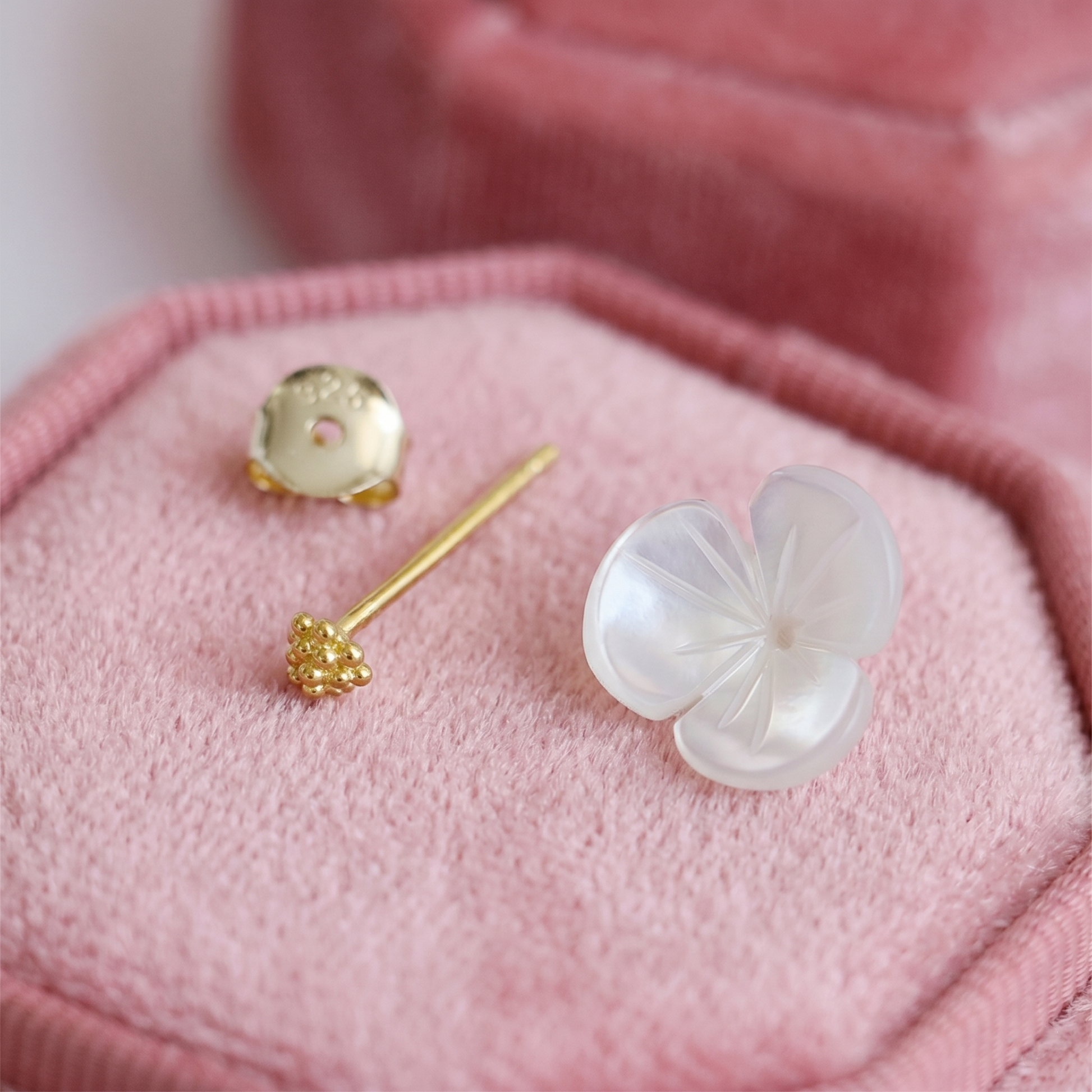 Shamrock stud earrings: white petal flower face with gold-tone stud back posts