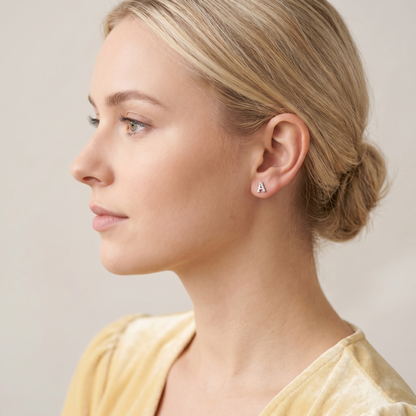 Mini CZ paved initial stud (A), silver-tone, worn on the ear