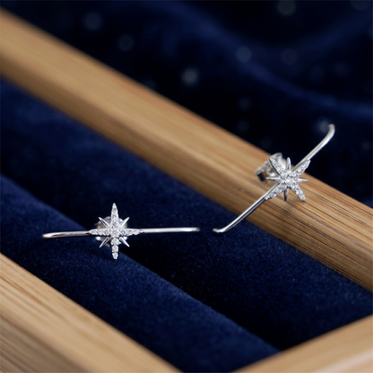 North Star suspender studs in rhodium-tone, starburst front view on jewelry stand